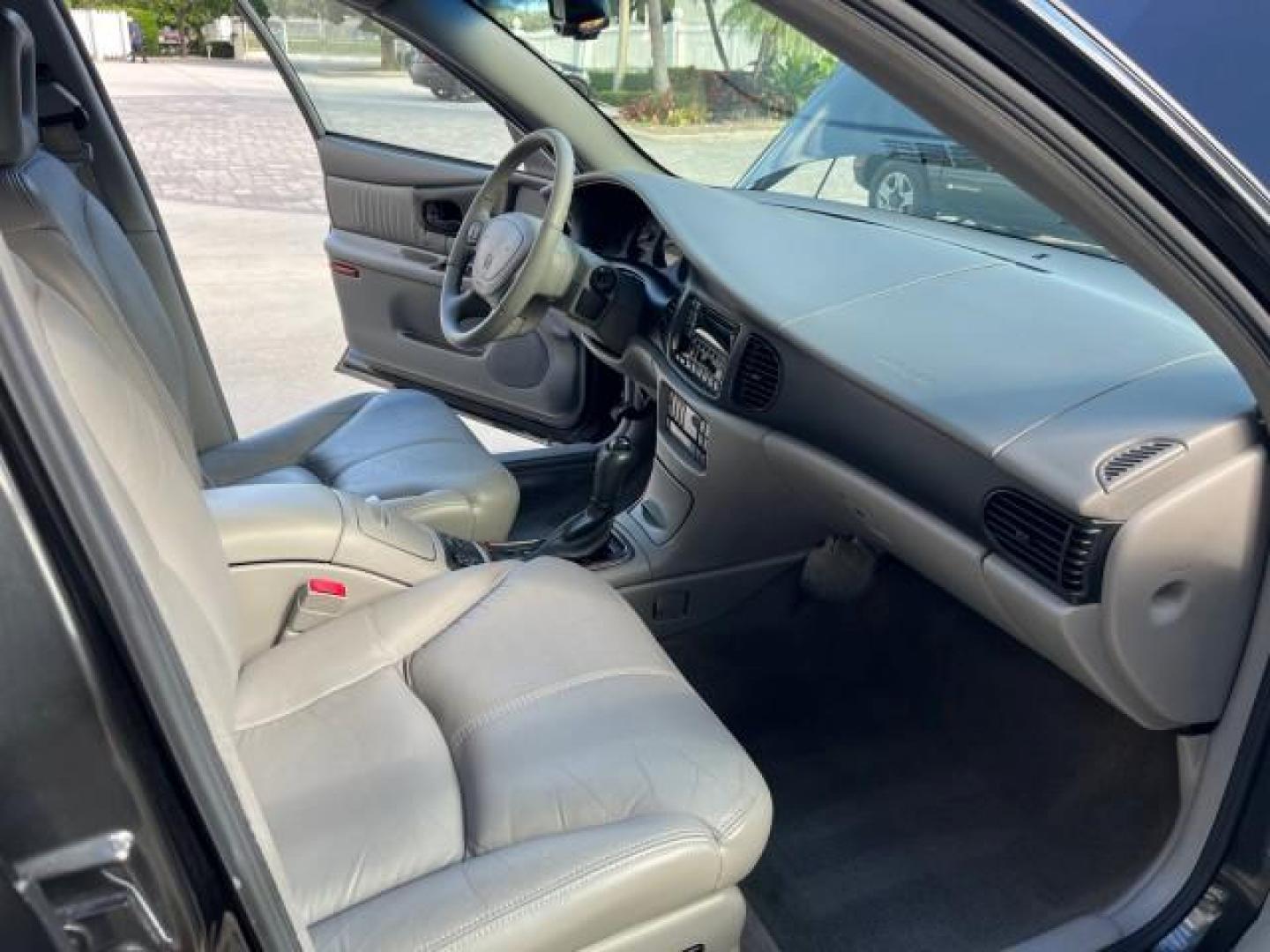 2003 Graphite Metallic /Medium Gray Buick Regal GS LOW MILES 34,898 SUPER CHARGED (2G4WF551031) with an 3.8L 3800 V6 SFI Supercharged Engine engine, Automatic transmission, located at 4701 North Dixie Hwy, Pompano Beach, FL, 33064, (954) 422-2889, 26.240938, -80.123474 - OUR WEBPAGE FLORIDACARS1.COM HAS OVER 100 PHOTOS AND FREE CARFAX LINK 2003 BUICK REGAL GS ROAD READY 3.8L V6 VIN: 2G4WF551031107030 NO ACCIDENTS 28 MPG SEDAN 4 DR NO RECALLS 1 OWNER 3.8L V6 F SUPER CHARGED VERY LOW MILES 34,898 GASOLINE POWER LEATHER SEATS FRONT WHEEL DRIVE SUPERCHARGED POWER SUNROO - Photo#27