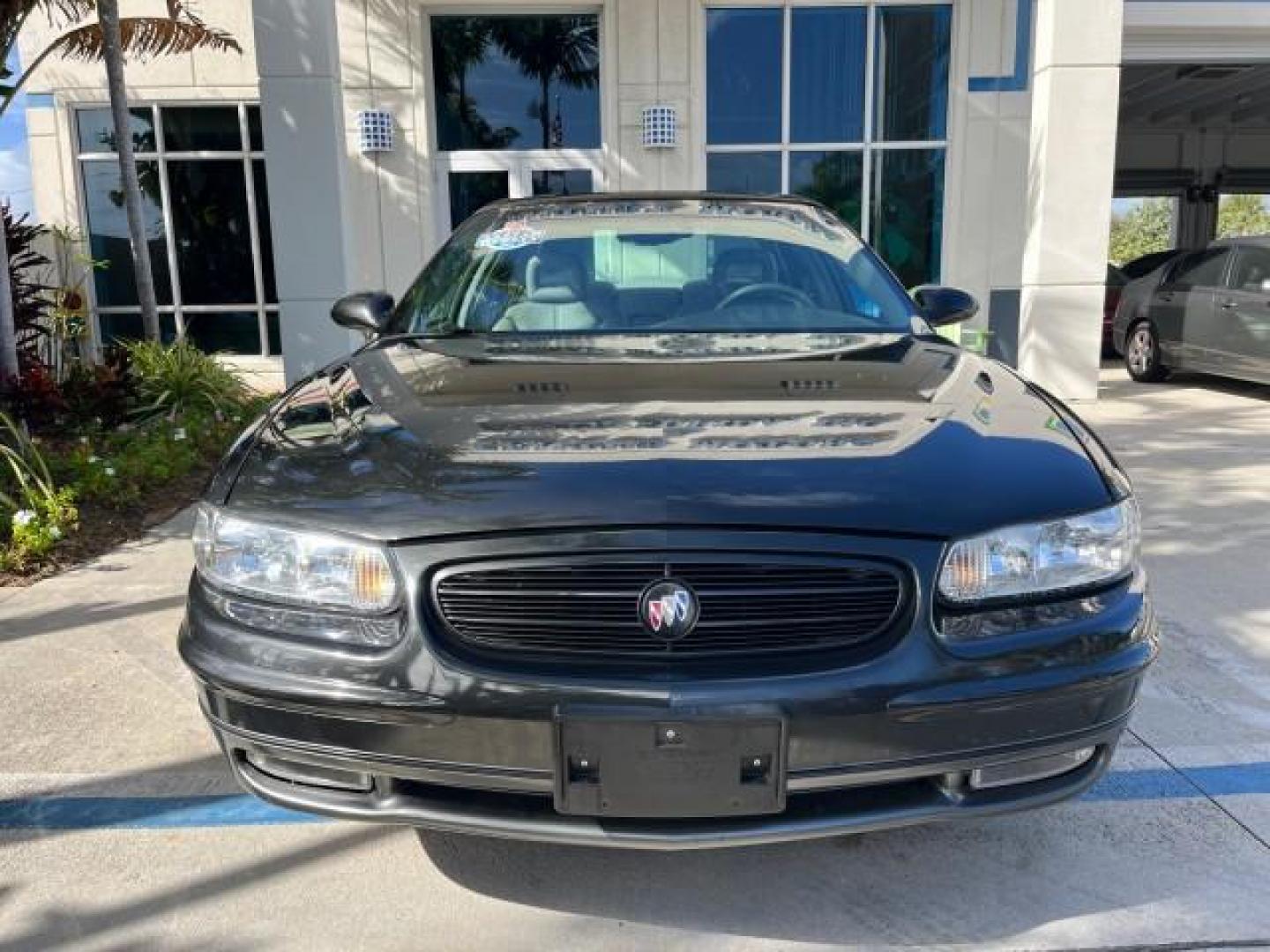 2003 Graphite Metallic /Medium Gray Buick Regal GS LOW MILES 34,898 SUPER CHARGED (2G4WF551031) with an 3.8L 3800 V6 SFI Supercharged Engine engine, Automatic transmission, located at 4701 North Dixie Hwy, Pompano Beach, FL, 33064, (954) 422-2889, 26.240938, -80.123474 - OUR WEBPAGE FLORIDACARS1.COM HAS OVER 100 PHOTOS AND FREE CARFAX LINK 2003 BUICK REGAL GS ROAD READY 3.8L V6 VIN: 2G4WF551031107030 NO ACCIDENTS 28 MPG SEDAN 4 DR NO RECALLS 1 OWNER 3.8L V6 F SUPER CHARGED VERY LOW MILES 34,898 GASOLINE POWER LEATHER SEATS FRONT WHEEL DRIVE SUPERCHARGED POWER SUNROO - Photo#80