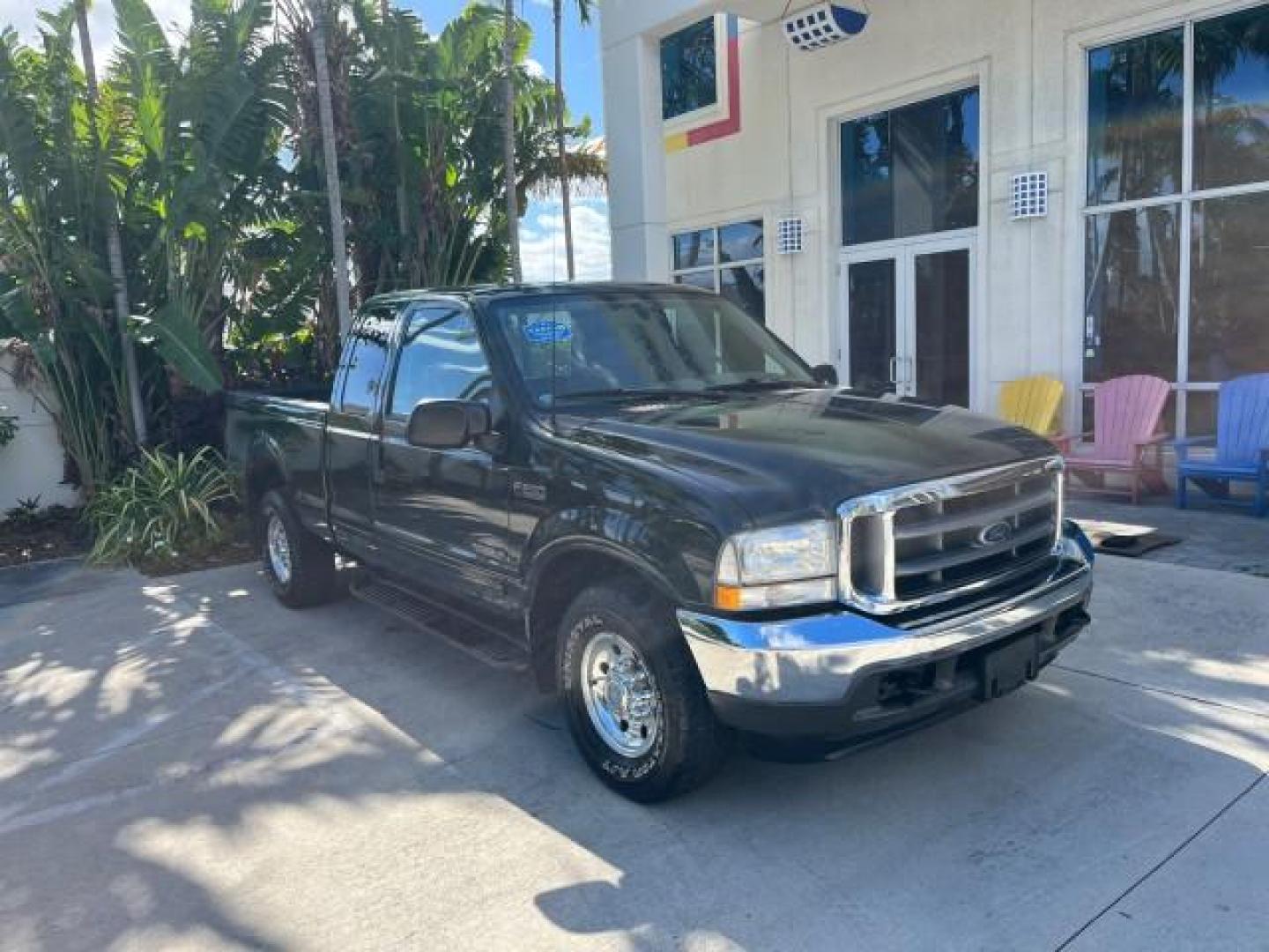 2002 Dark Highland Green Metallic /Medium Parchment Ford Super Duty F-250 7.3 TURBO DIESEL XLT LOW MILES 61,862 (1FTNX20F12E) with an 7.3L DI V8 Turbo-Diesel Power Stroke Engine engine, Automatic transmission, located at 4701 North Dixie Hwy, Pompano Beach, FL, 33064, (954) 422-2889, 26.240938, -80.123474 - OUR WEBPAGE FLORIDACARS1.COM HAS OVER 100 PHOTOS AND FREE CARFAX LINK 2002 FORD F-250 SUPER DUTY LARIAT ROAD READY WORK READY VIN: 1FTNX20F12EB61805 NO ACCIDENTS NO RECALLS 4 DOOR EXTENDED CAB PICKUP POWER SEATS/MIRRORS 7.3L V8 F 7.3L V8 TURBO DIESEL DIESEL LOW MILES 61,862 REAR WHEEL DRIVE 6,9 FT B - Photo#1