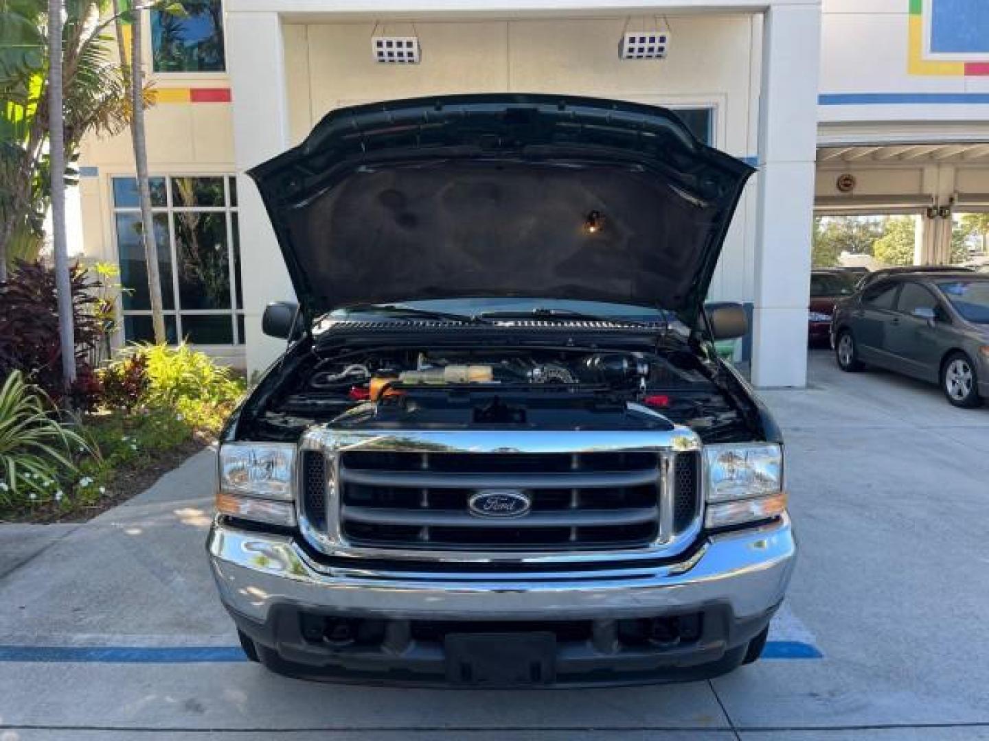 2002 Dark Highland Green Metallic /Medium Parchment Ford Super Duty F-250 7.3 TURBO DIESEL XLT LOW MILES 61,862 (1FTNX20F12E) with an 7.3L DI V8 Turbo-Diesel Power Stroke Engine engine, Automatic transmission, located at 4701 North Dixie Hwy, Pompano Beach, FL, 33064, (954) 422-2889, 26.240938, -80.123474 - OUR WEBPAGE FLORIDACARS1.COM HAS OVER 100 PHOTOS AND FREE CARFAX LINK 2002 FORD F-250 SUPER DUTY LARIAT ROAD READY WORK READY VIN: 1FTNX20F12EB61805 NO ACCIDENTS NO RECALLS 4 DOOR EXTENDED CAB PICKUP POWER SEATS/MIRRORS 7.3L V8 F 7.3L V8 TURBO DIESEL DIESEL LOW MILES 61,862 REAR WHEEL DRIVE 6,9 FT B - Photo#77