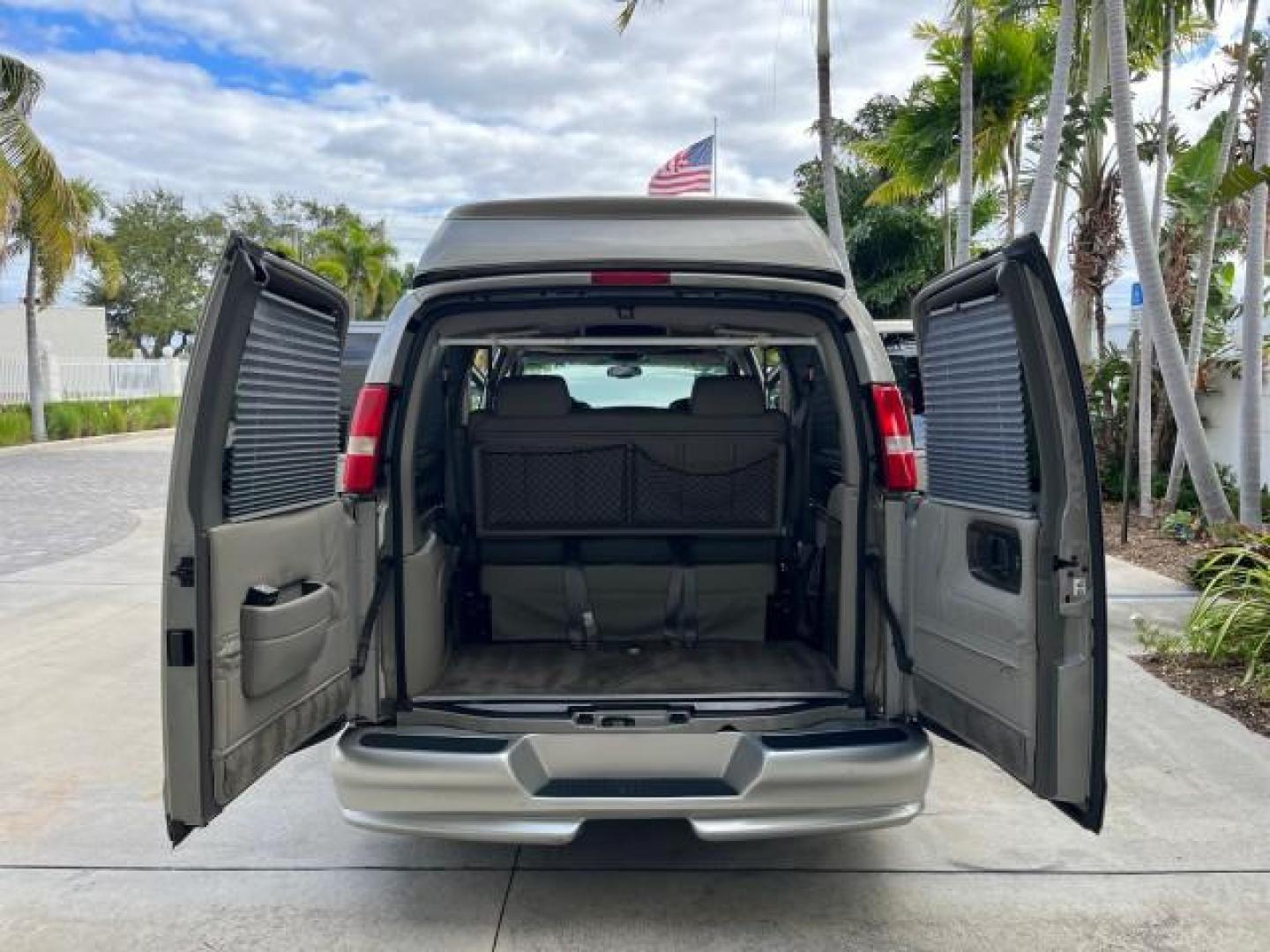 2003 Light Pewter Metallic /Medium Pewter Chevrolet Express conv Van HI TOP EXPLORER CONV LO MI 84,354 (1GBFG15T331) with an 5.3L Vortec 5300 V8 SFI Engine engine, Automatic transmission, located at 4701 North Dixie Hwy, Pompano Beach, FL, 33064, (954) 422-2889, 26.240938, -80.123474 - OUR WEBPAGE FLORIDACARS1.COM HAS OVER 100 PHOTOS AND FREE CARFAX LINK 2003 CHEVROLET EXPRESS G1500 ROAD READY 5.3L V8 VIN: 1GBFG15T331233422 NO ACCIDENTS NO RECALLS VAN LOW MILES 84,354 5.3L V8 F OHV 3 ROW POWER LEATHER SEATS GASOLINE TV DVD VIDEO REAR WHEEL DRIVE $64,289 NEW POWER MIRRORS Alloy Whe - Photo#15