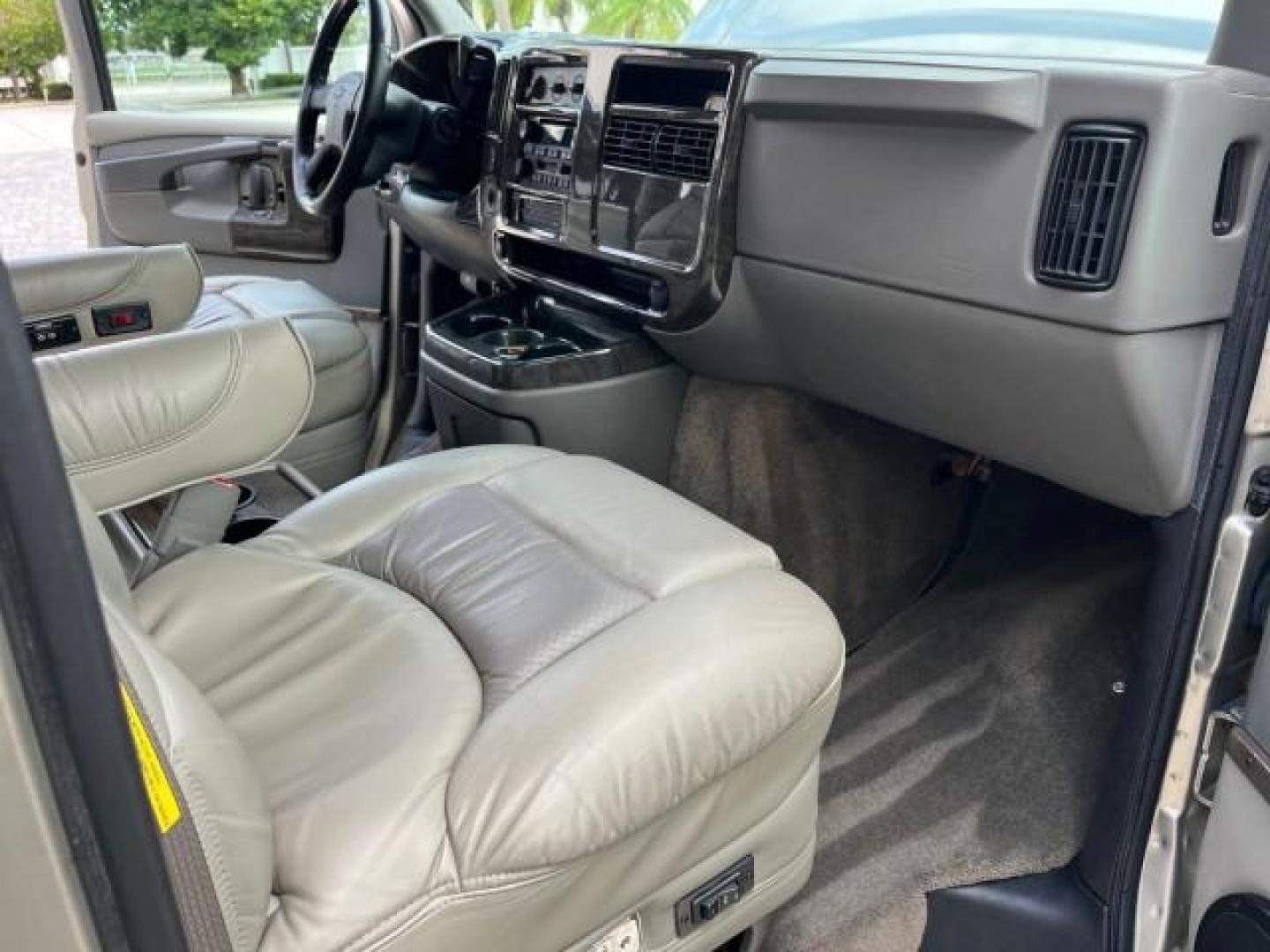 2003 Light Pewter Metallic /Medium Pewter Chevrolet Express conv Van HI TOP EXPLORER CONV LO MI 84,354 (1GBFG15T331) with an 5.3L Vortec 5300 V8 SFI Engine engine, Automatic transmission, located at 4701 North Dixie Hwy, Pompano Beach, FL, 33064, (954) 422-2889, 26.240938, -80.123474 - OUR WEBPAGE FLORIDACARS1.COM HAS OVER 100 PHOTOS AND FREE CARFAX LINK 2003 CHEVROLET EXPRESS G1500 ROAD READY 5.3L V8 VIN: 1GBFG15T331233422 NO ACCIDENTS NO RECALLS VAN LOW MILES 84,354 5.3L V8 F OHV 3 ROW POWER LEATHER SEATS GASOLINE TV DVD VIDEO REAR WHEEL DRIVE $64,289 NEW POWER MIRRORS Alloy Whe - Photo#28