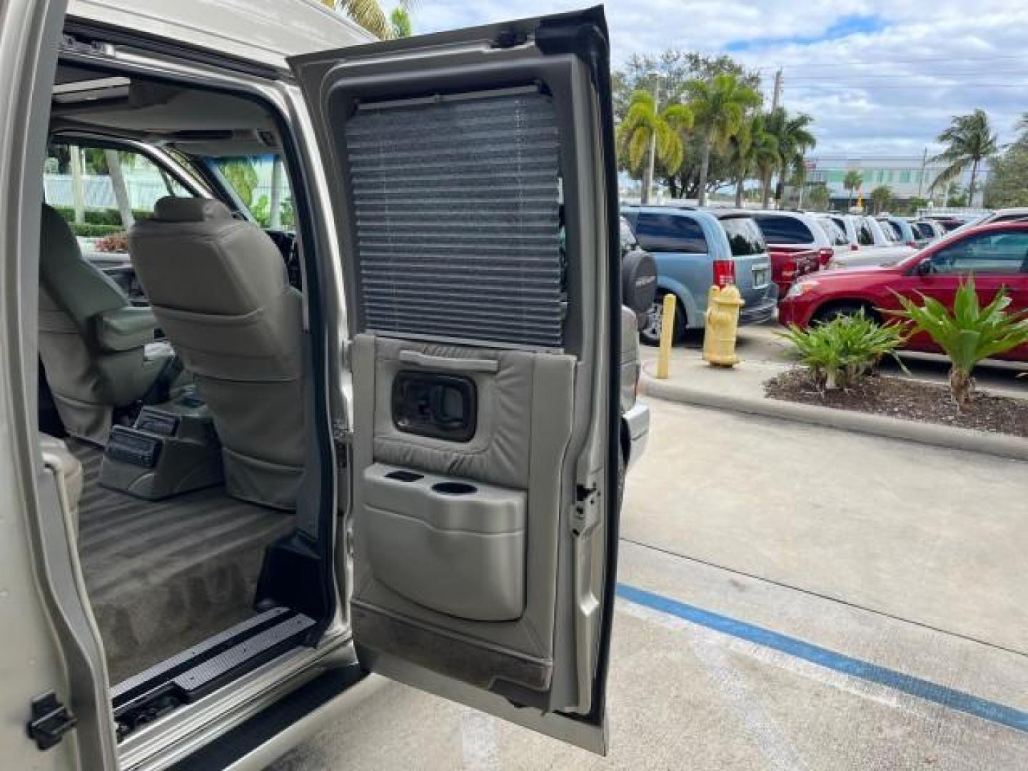 2003 Light Pewter Metallic /Medium Pewter Chevrolet Express conv Van HI TOP EXPLORER CONV LO MI 84,354 (1GBFG15T331) with an 5.3L Vortec 5300 V8 SFI Engine engine, Automatic transmission, located at 4701 North Dixie Hwy, Pompano Beach, FL, 33064, (954) 422-2889, 26.240938, -80.123474 - OUR WEBPAGE FLORIDACARS1.COM HAS OVER 100 PHOTOS AND FREE CARFAX LINK 2003 CHEVROLET EXPRESS G1500 ROAD READY 5.3L V8 VIN: 1GBFG15T331233422 NO ACCIDENTS NO RECALLS VAN LOW MILES 84,354 5.3L V8 F OHV 3 ROW POWER LEATHER SEATS GASOLINE TV DVD VIDEO REAR WHEEL DRIVE $64,289 NEW POWER MIRRORS Alloy Whe - Photo#33