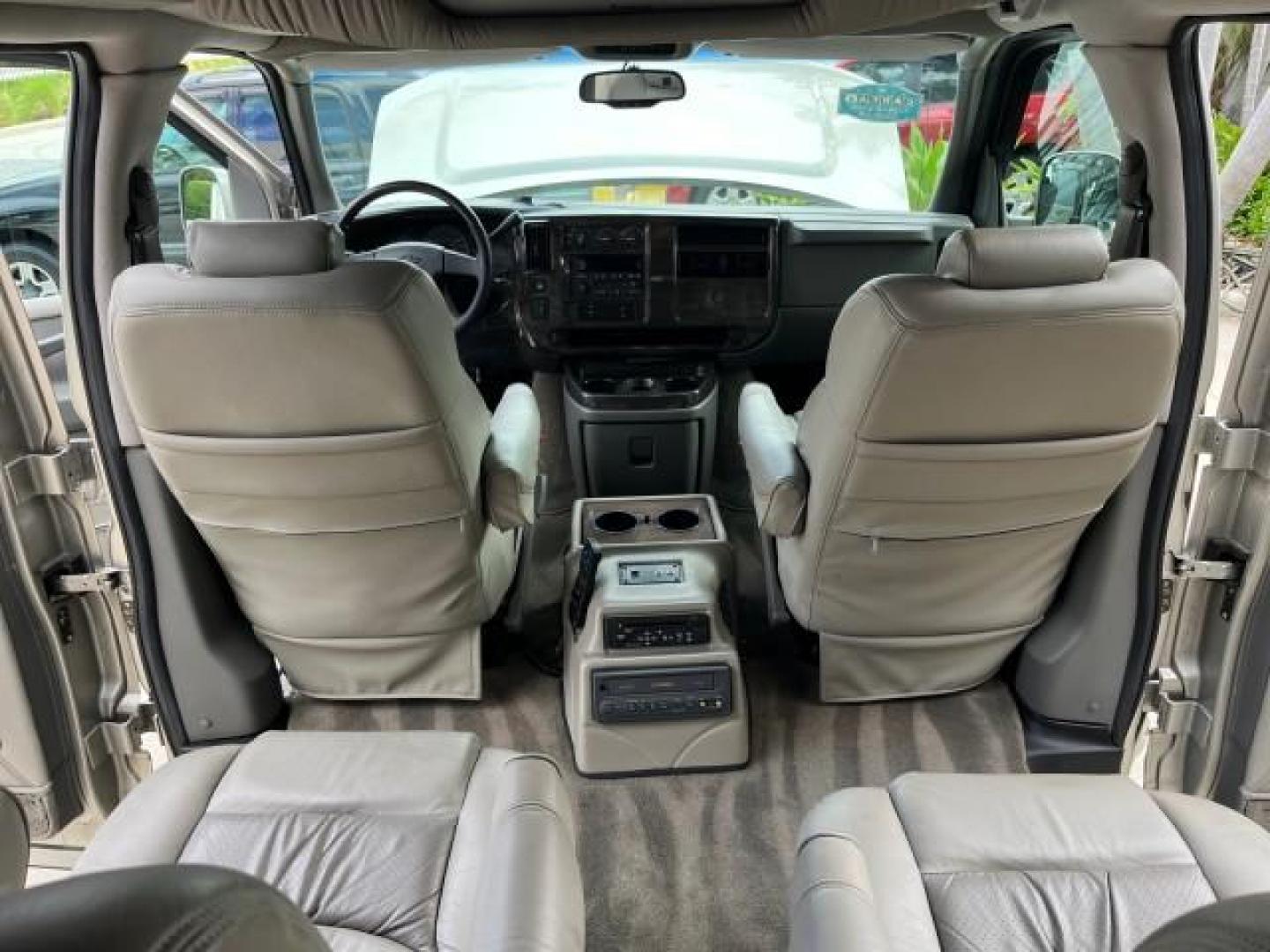 2003 Light Pewter Metallic /Medium Pewter Chevrolet Express conv Van HI TOP EXPLORER CONV LO MI 84,354 (1GBFG15T331) with an 5.3L Vortec 5300 V8 SFI Engine engine, Automatic transmission, located at 4701 North Dixie Hwy, Pompano Beach, FL, 33064, (954) 422-2889, 26.240938, -80.123474 - OUR WEBPAGE FLORIDACARS1.COM HAS OVER 100 PHOTOS AND FREE CARFAX LINK 2003 CHEVROLET EXPRESS G1500 ROAD READY 5.3L V8 VIN: 1GBFG15T331233422 NO ACCIDENTS NO RECALLS VAN LOW MILES 84,354 5.3L V8 F OHV 3 ROW POWER LEATHER SEATS GASOLINE TV DVD VIDEO REAR WHEEL DRIVE $64,289 NEW POWER MIRRORS Alloy Whe - Photo#60