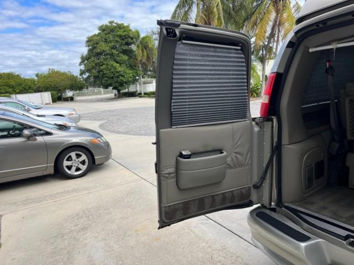 2003 Light Pewter Metallic /Medium Pewter Chevrolet Express conv Van HI TOP EXPLORER CONV LO MI 84,354 (1GBFG15T331) with an 5.3L Vortec 5300 V8 SFI Engine engine, Automatic transmission, located at 4701 North Dixie Hwy, Pompano Beach, FL, 33064, (954) 422-2889, 26.240938, -80.123474 - OUR WEBPAGE FLORIDACARS1.COM HAS OVER 100 PHOTOS AND FREE CARFAX LINK 2003 CHEVROLET EXPRESS G1500 ROAD READY 5.3L V8 VIN: 1GBFG15T331233422 NO ACCIDENTS NO RECALLS VAN LOW MILES 84,354 5.3L V8 F OHV 3 ROW POWER LEATHER SEATS GASOLINE TV DVD VIDEO REAR WHEEL DRIVE $64,289 NEW POWER MIRRORS Alloy Whe - Photo#77