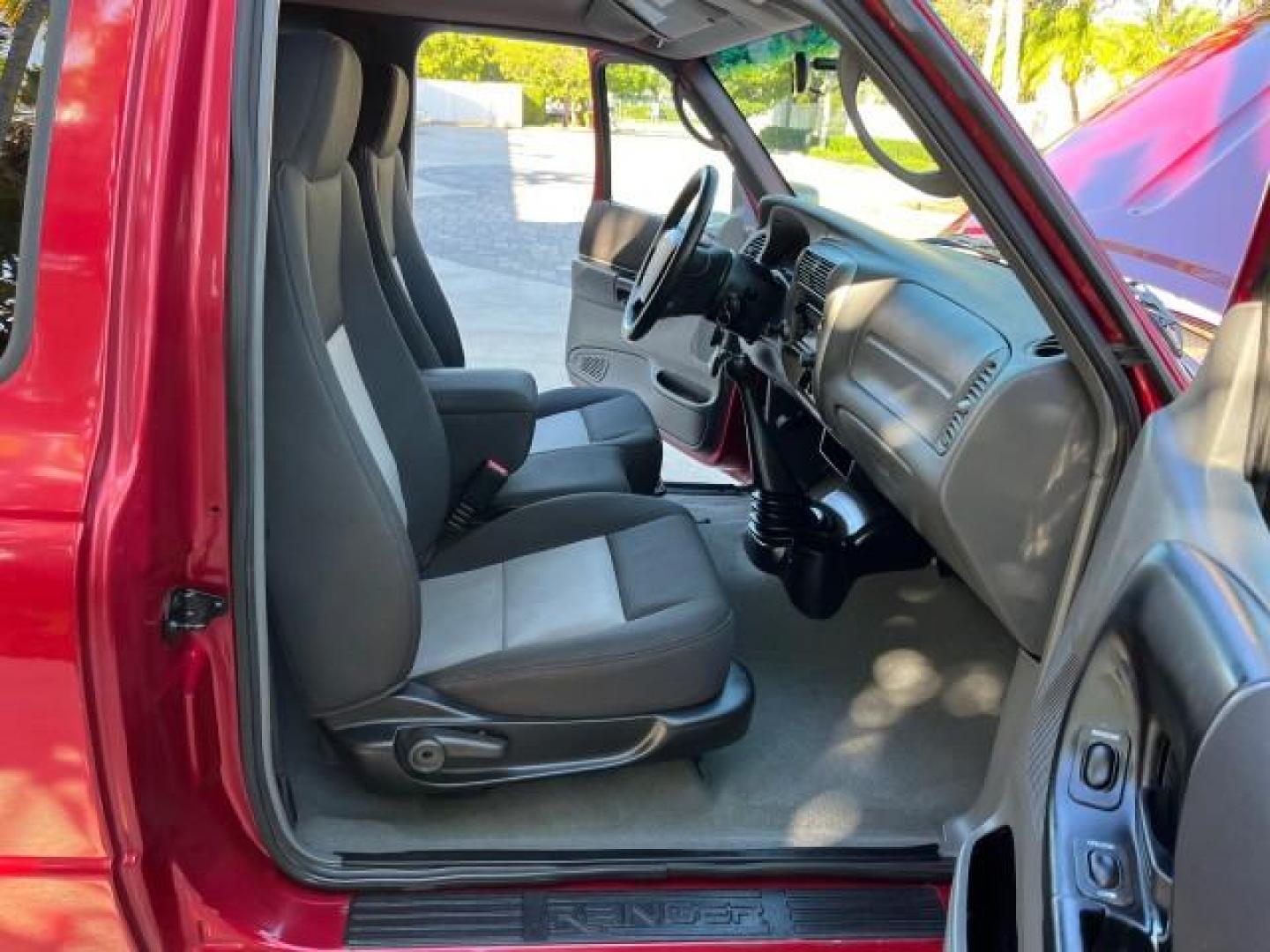 2007 Redfire /Medium Dk Flint Ford Ranger FL XLT LOW MILES 71,438 5SPD (1FTYR14D47P) with an 2.3L DOHC 16-Valve I4 Engine engine, Manual transmission, located at 4701 North Dixie Hwy, Pompano Beach, FL, 33064, (954) 422-2889, 26.240938, -80.123474 - OUR WEBPAGE FLORIDACARS1.COM HAS OVER 100 PHOTOS AND FREE CARFAX LINK 2007 FORD RANGER XL ROAD READY WORK READY VIN: 1FTYR14D47PA12424 NO ACCIDENTS 2.3L I4 CLUB CAB PICKUP FLORIDA OWNER 29 MPG 2.3L 4 F 5 SPD 4 CYL HARD TO FIND LOW MILES 71,438 XLT GASOLINE 6.0 FT BED LENGTH REAR WHEEL DRIVE MANUAL 1 - Photo#12