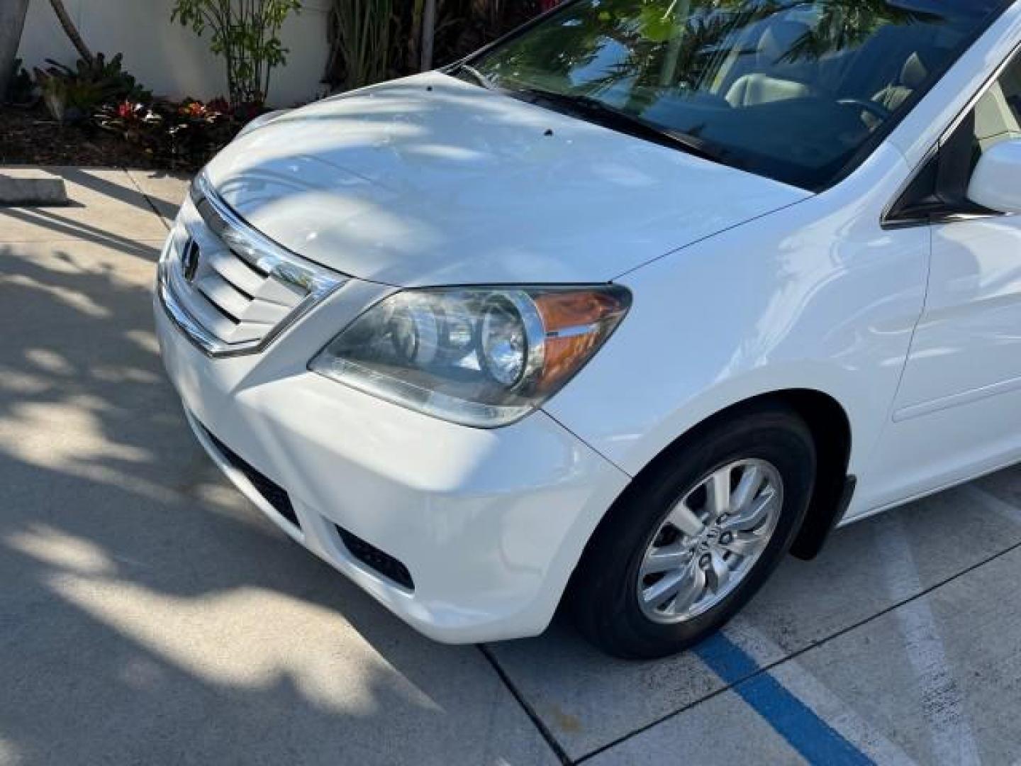 2010 Taffeta White /Ivory Honda Odyssey EX-L LOW MILES 78,635 (5FNRL3H73AB) with an 3.5L V6 Cylinder Engine engine, Automatic transmission, located at 4701 North Dixie Hwy, Pompano Beach, FL, 33064, (954) 422-2889, 26.240938, -80.123474 - OUR WEBPAGE FLORIDACARS1.COM HAS OVER 100 PHOTOS AND FREE CARFAX LINK 2010 HONDA ODYSSEY EX-L W/DVD ROAD READY 3.5L V6 25 MPG VIN: 5FNRL3H73AB055515 NO ACCIDENTS NO RECALLS VAN FLORIDA OWNER SUNROOF 3.5L V6 F SOHC 24V BACK UP CAMERA POWER SLIDING DOORS DVD GASOLINE LOW MILES 78,635 3 ROW POWER LEATH - Photo#97