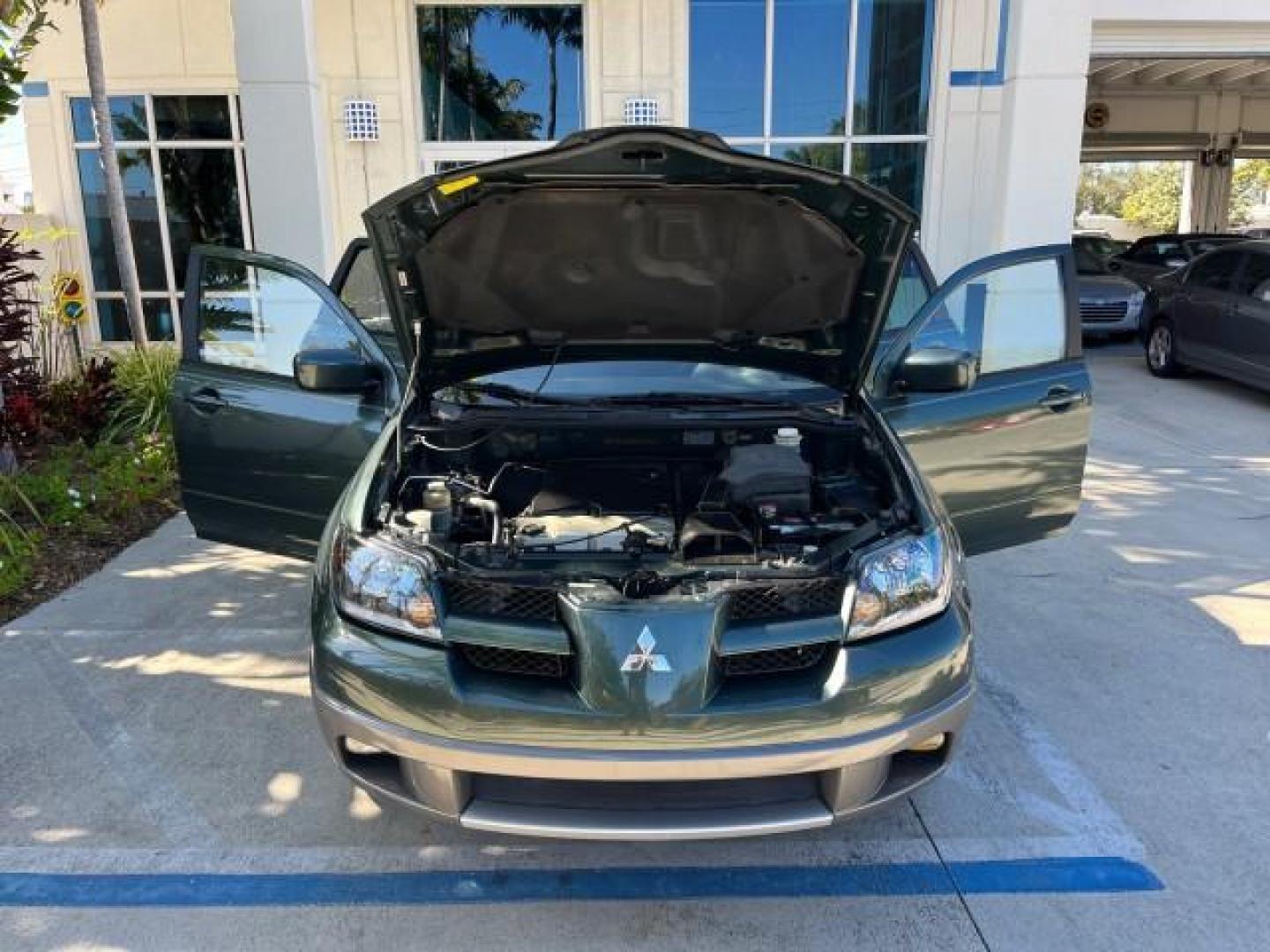 2004 Lofty Green Pearl /Charcoal Mitsubishi Outlander XLS LOW MILES 38,372 (JA4LX41F44U) with an 2.4L SOHC SMPI 16-Valve I4 Engine engine, Automatic transmission, located at 4701 North Dixie Hwy, Pompano Beach, FL, 33064, (954) 422-2889, 26.240938, -80.123474 - OUR WEBPAGE FLORIDACARS1.COM HAS OVER 100 PHOTOS AND FREE CARFAX LINK 2004 MITSUBISHI OUTLANDER XLS ROAD READY 2.4L I4 VIN: JA4LX41F44U045177 NO ACCIDENTS 27 MPG DOOR WAGON/SPORT UTILITY NO RECALLS 2.4L I4 F SOHC FLORIDA OWNER GASOLINE LOW MILES 38,372 FRONT WHEEL DRIVE 10 SERVICE RECORDS Alloy Whee - Photo#16