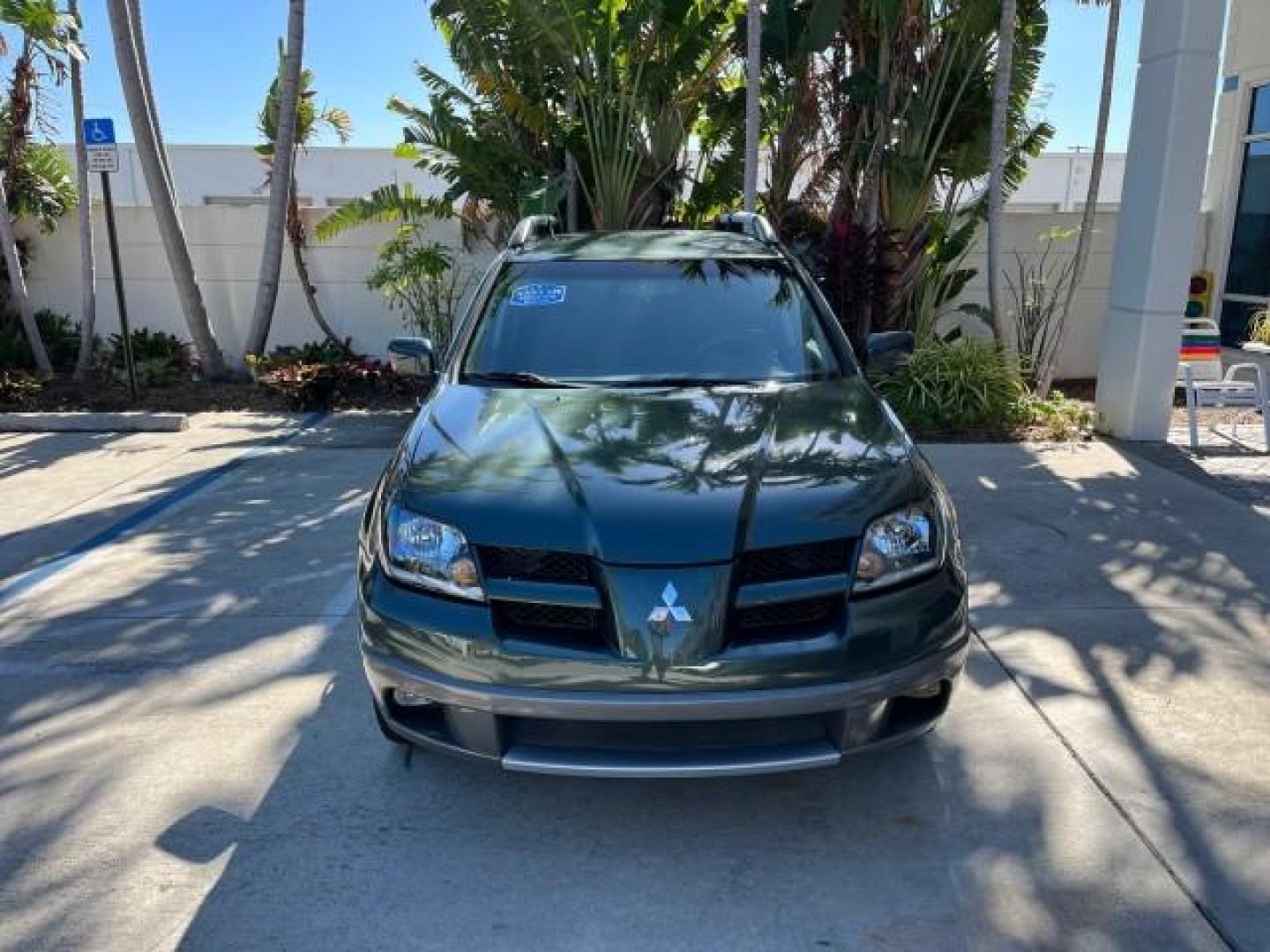 2004 Lofty Green Pearl /Charcoal Mitsubishi Outlander XLS LOW MILES 38,372 (JA4LX41F44U) with an 2.4L SOHC SMPI 16-Valve I4 Engine engine, Automatic transmission, located at 4701 North Dixie Hwy, Pompano Beach, FL, 33064, (954) 422-2889, 26.240938, -80.123474 - OUR WEBPAGE FLORIDACARS1.COM HAS OVER 100 PHOTOS AND FREE CARFAX LINK 2004 MITSUBISHI OUTLANDER XLS ROAD READY 2.4L I4 VIN: JA4LX41F44U045177 NO ACCIDENTS 27 MPG DOOR WAGON/SPORT UTILITY NO RECALLS 2.4L I4 F SOHC FLORIDA OWNER GASOLINE LOW MILES 38,372 FRONT WHEEL DRIVE 10 SERVICE RECORDS Alloy Whee - Photo#2