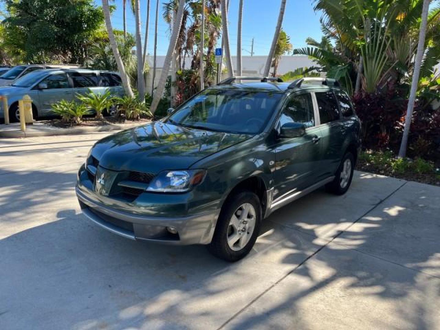 2004 Lofty Green Pearl /Charcoal Mitsubishi Outlander XLS LOW MILES 38,372 (JA4LX41F44U) with an 2.4L SOHC SMPI 16-Valve I4 Engine engine, Automatic transmission, located at 4701 North Dixie Hwy, Pompano Beach, FL, 33064, (954) 422-2889, 26.240938, -80.123474 - OUR WEBPAGE FLORIDACARS1.COM HAS OVER 100 PHOTOS AND FREE CARFAX LINK 2004 MITSUBISHI OUTLANDER XLS ROAD READY 2.4L I4 VIN: JA4LX41F44U045177 NO ACCIDENTS 27 MPG DOOR WAGON/SPORT UTILITY NO RECALLS 2.4L I4 F SOHC FLORIDA OWNER GASOLINE LOW MILES 38,372 FRONT WHEEL DRIVE 10 SERVICE RECORDS Alloy Whee - Photo#3