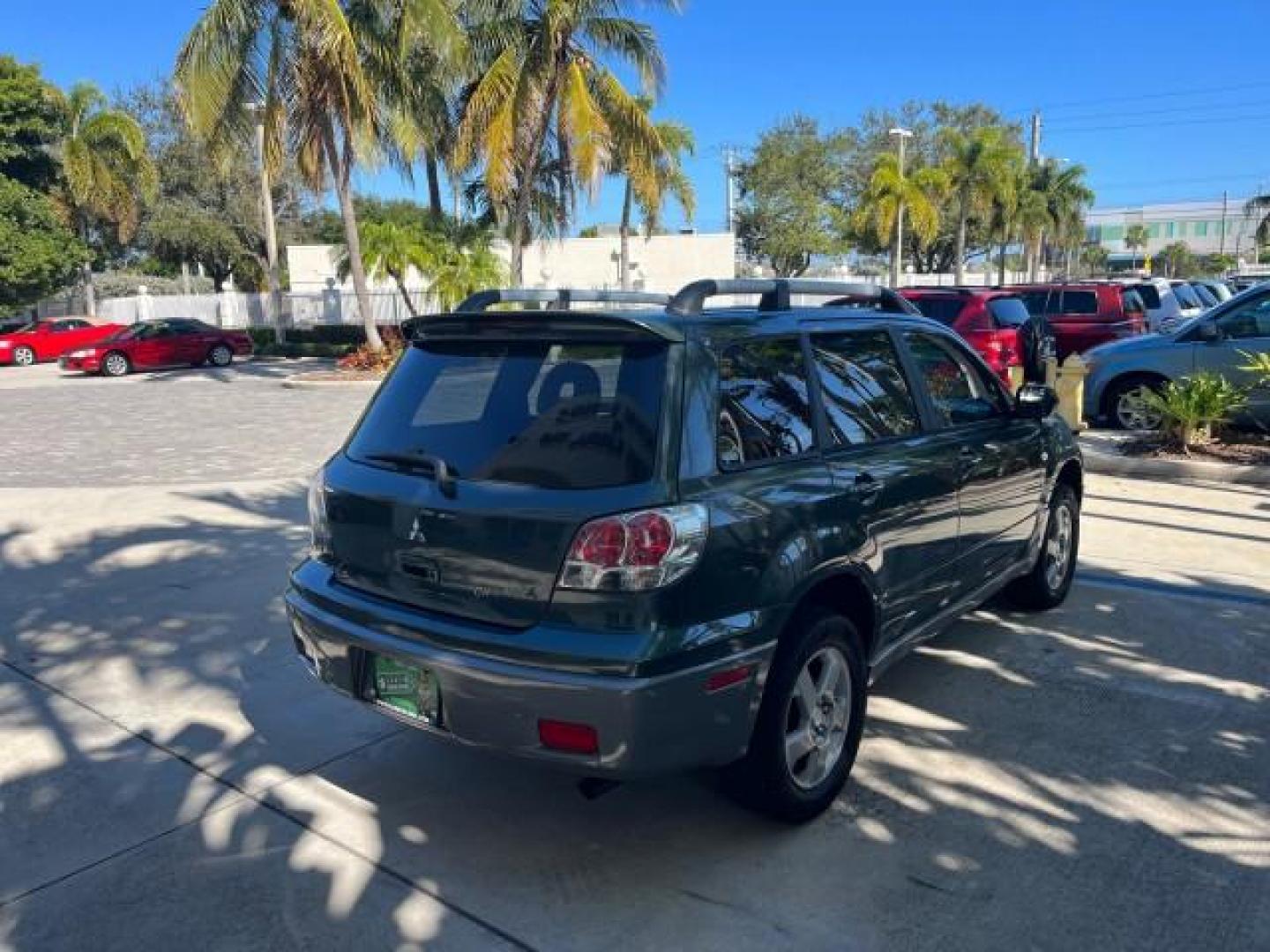 2004 Lofty Green Pearl /Charcoal Mitsubishi Outlander XLS LOW MILES 38,372 (JA4LX41F44U) with an 2.4L SOHC SMPI 16-Valve I4 Engine engine, Automatic transmission, located at 4701 North Dixie Hwy, Pompano Beach, FL, 33064, (954) 422-2889, 26.240938, -80.123474 - OUR WEBPAGE FLORIDACARS1.COM HAS OVER 100 PHOTOS AND FREE CARFAX LINK 2004 MITSUBISHI OUTLANDER XLS ROAD READY 2.4L I4 VIN: JA4LX41F44U045177 NO ACCIDENTS 27 MPG DOOR WAGON/SPORT UTILITY NO RECALLS 2.4L I4 F SOHC FLORIDA OWNER GASOLINE LOW MILES 38,372 FRONT WHEEL DRIVE 10 SERVICE RECORDS Alloy Whee - Photo#7