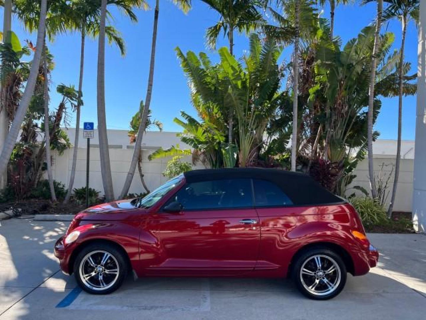 2005 Inferno Red Crystal Pearl /Dark Slate Gray Chrysler PT Cruiser GT LOW MILES 59,572 (3C3AY75S35T) with an 2.4L DOHC 16-Valve HO Turbo I4 Engine engine, Automatic transmission, located at 4701 North Dixie Hwy, Pompano Beach, FL, 33064, (954) 422-2889, 26.240938, -80.123474 - OUR WEBPAGE FLORIDACARS1.COM HAS OVER 100 PHOTOS AND FREE CARFAX LINK 2005 CHRYSLER PT CRUISER GT ROAD READY 2.4L I4 GT VIN: 3C3AY75S35T265610 LOW MILES 59,572 CONVERTIBLE NO ACCIDENTS NO RECALLS 2.4L I4 F DOHC 16V FLORIDA OWNER 27 MPG GASOLINE POWER LEATHER SEATS FRONT WHEEL DRIVE TURBO POWER CONVE - Photo#4