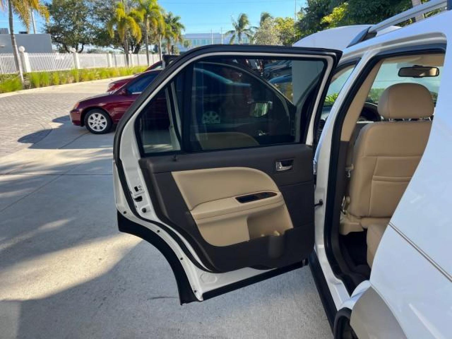 2008 Oxford White /Camel Ford Taurus X Eddie Bauer LOW MILES 39,063 (1FMDK07W18G) with an 3.5L SMPI 24-Valve V6 Duratec Engine engine, Automatic transmission, located at 4701 North Dixie Hwy, Pompano Beach, FL, 33064, (954) 422-2889, 26.240938, -80.123474 - OUR WEBPAGE FLORIDACARS1.COM HAS OVER 100 PHOTOS AND FREE CARFAX LINK 2008 FORD TAURUS X EDDIE BAUER ROAD READY 3.5L V6 VIN: 1FMDK07W18GA43864 FLORIDA OWNER 4 DOOR WAGON/SPORT UTILITY LOW MILES 39,063 3.5L V6 F 3 ROW LEATHER SEATS GASOLINE PARK SENSORS POWER SEATS/MIRRORS FRONT WHEEL DRIVE POWER SUN - Photo#13