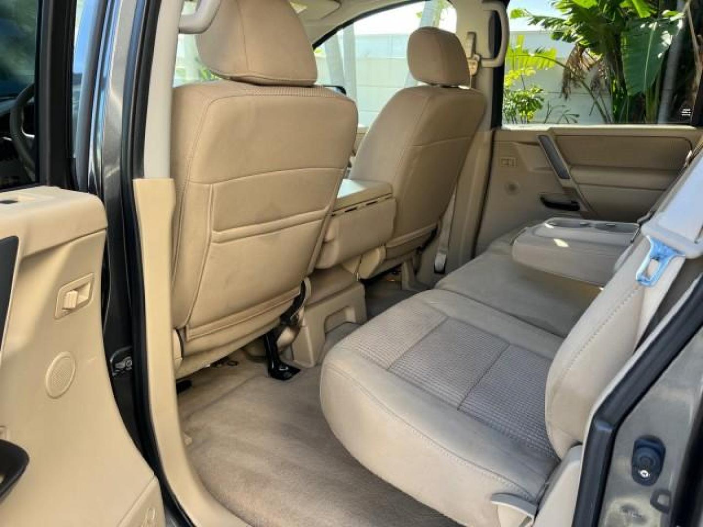 2009 Smoke Gray /Almond Nissan Titan CREW CAB LE LOW MILES 125,781 (1N6BA07D29N) with an 5.6L DOHC 32-Valve V8 FFV Engine engine, Automatic transmission, located at 4701 North Dixie Hwy, Pompano Beach, FL, 33064, (954) 422-2889, 26.240938, -80.123474 - OUR WEBPAGE FLORIDACARS1.COM HAS OVER 100 PHOTOS AND FREE CARFAX LINK 2009 NISSAN TITAN SE FFV ROAD READY WORK READY VIN: 1N6BA07D29N304796 FLORIDA OWNER 5.6L V8 CREW PICKUP LOW MILES 125,781 5.6L V8 F DOHC 32V BACK UP SENSORS FLEX FUEL 15 SERVICE RECORDS REAR WHEEL DRIVE POWER SEATS 5,6FT BED LENGH - Photo#39