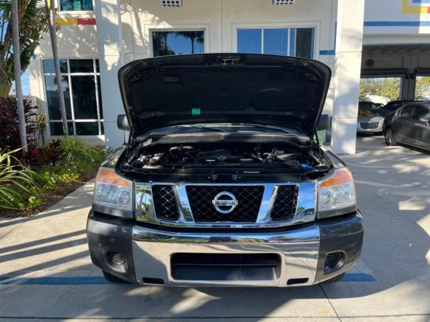 2009 Smoke Gray /Almond Nissan Titan CREW CAB LE LOW MILES 125,781 (1N6BA07D29N) with an 5.6L DOHC 32-Valve V8 FFV Engine engine, Automatic transmission, located at 4701 North Dixie Hwy, Pompano Beach, FL, 33064, (954) 422-2889, 26.240938, -80.123474 - OUR WEBPAGE FLORIDACARS1.COM HAS OVER 100 PHOTOS AND FREE CARFAX LINK 2009 NISSAN TITAN SE FFV ROAD READY WORK READY VIN: 1N6BA07D29N304796 FLORIDA OWNER 5.6L V8 CREW PICKUP LOW MILES 125,781 5.6L V8 F DOHC 32V BACK UP SENSORS FLEX FUEL 15 SERVICE RECORDS REAR WHEEL DRIVE POWER SEATS 5,6FT BED LENGH - Photo#70