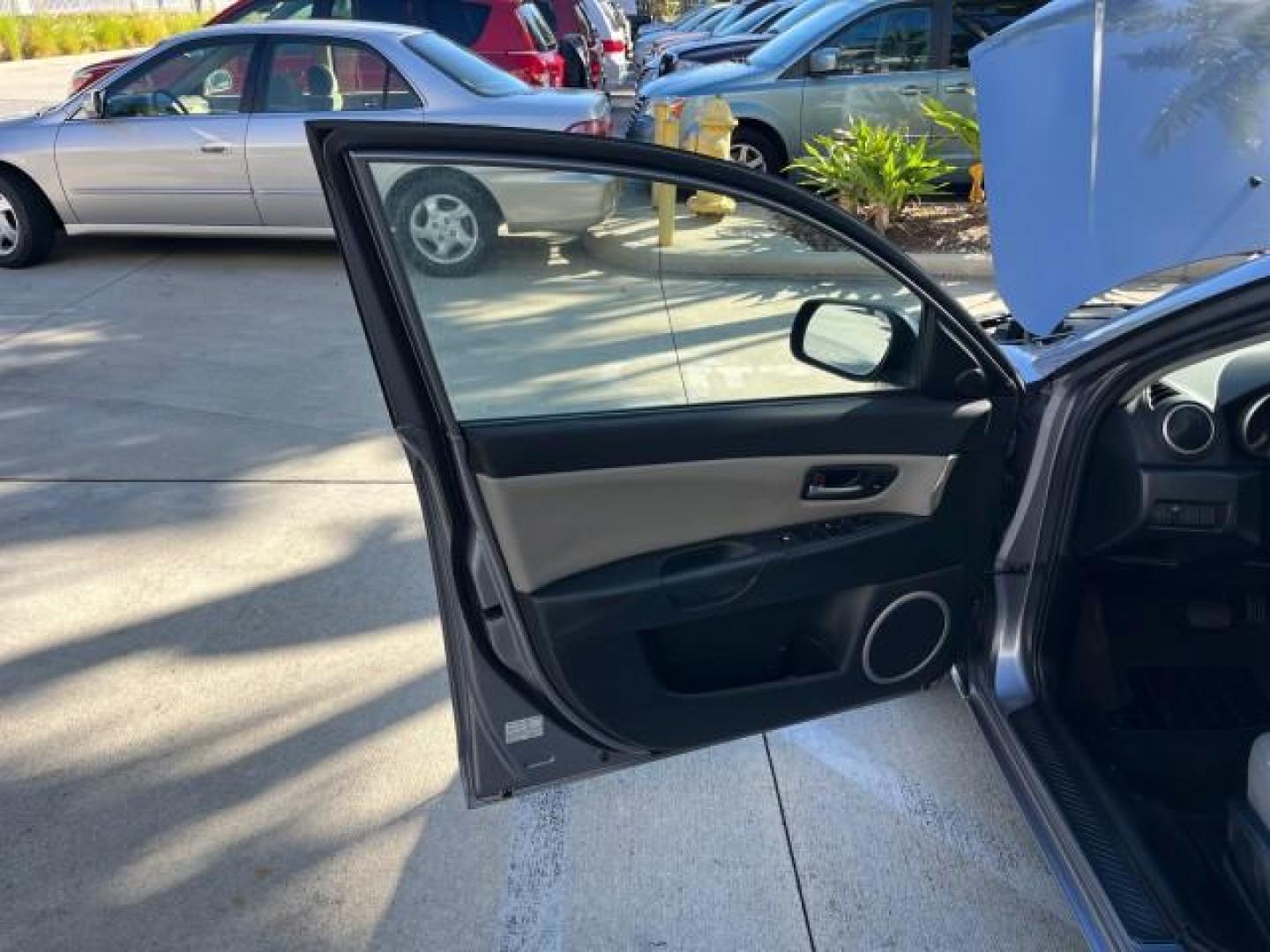 2005 Titanium Gray Metallic /Black Mazda Mazda3 s SUNROOF LOW MILES 43,509 (JM1BK323951) with an 2.3L DOHC MPFI 16-Valve 4-Cyl Engine engine, Automatic transmission, located at 4701 North Dixie Hwy, Pompano Beach, FL, 33064, (954) 422-2889, 26.240938, -80.123474 - OUR WEBPAGE FLORIDACARS1.COM HAS OVER 100 PHOTOS AND FREE CARFAX LINK 2005 MAZDA MAZDA3 S ROAD READY 2.3L I4 VIN: JM1BK323951253248 NO ACCIDENTS 29 MPG SEDAN 4 DR NO RECALLS 1 OWNER 2.3L I4 F DOHC 16V LOW MILES 43,509 GASOLINE POWER SUNROOF LEATHER FRONT WHEEL DRIVE 26 SERVICE RECORDS Alloy Wheels A - Photo#9