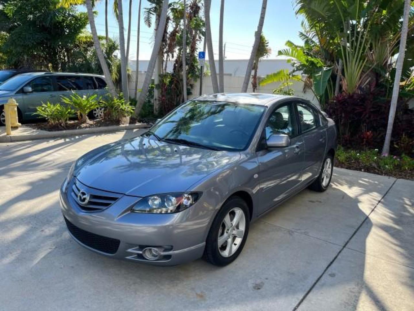 2005 Titanium Gray Metallic /Black Mazda Mazda3 s SUNROOF LOW MILES 43,509 (JM1BK323951) with an 2.3L DOHC MPFI 16-Valve 4-Cyl Engine engine, Automatic transmission, located at 4701 North Dixie Hwy, Pompano Beach, FL, 33064, (954) 422-2889, 26.240938, -80.123474 - OUR WEBPAGE FLORIDACARS1.COM HAS OVER 100 PHOTOS AND FREE CARFAX LINK 2005 MAZDA MAZDA3 S ROAD READY 2.3L I4 VIN: JM1BK323951253248 NO ACCIDENTS 29 MPG SEDAN 4 DR NO RECALLS 1 OWNER 2.3L I4 F DOHC 16V LOW MILES 43,509 GASOLINE POWER SUNROOF LEATHER FRONT WHEEL DRIVE 26 SERVICE RECORDS Alloy Wheels A - Photo#3