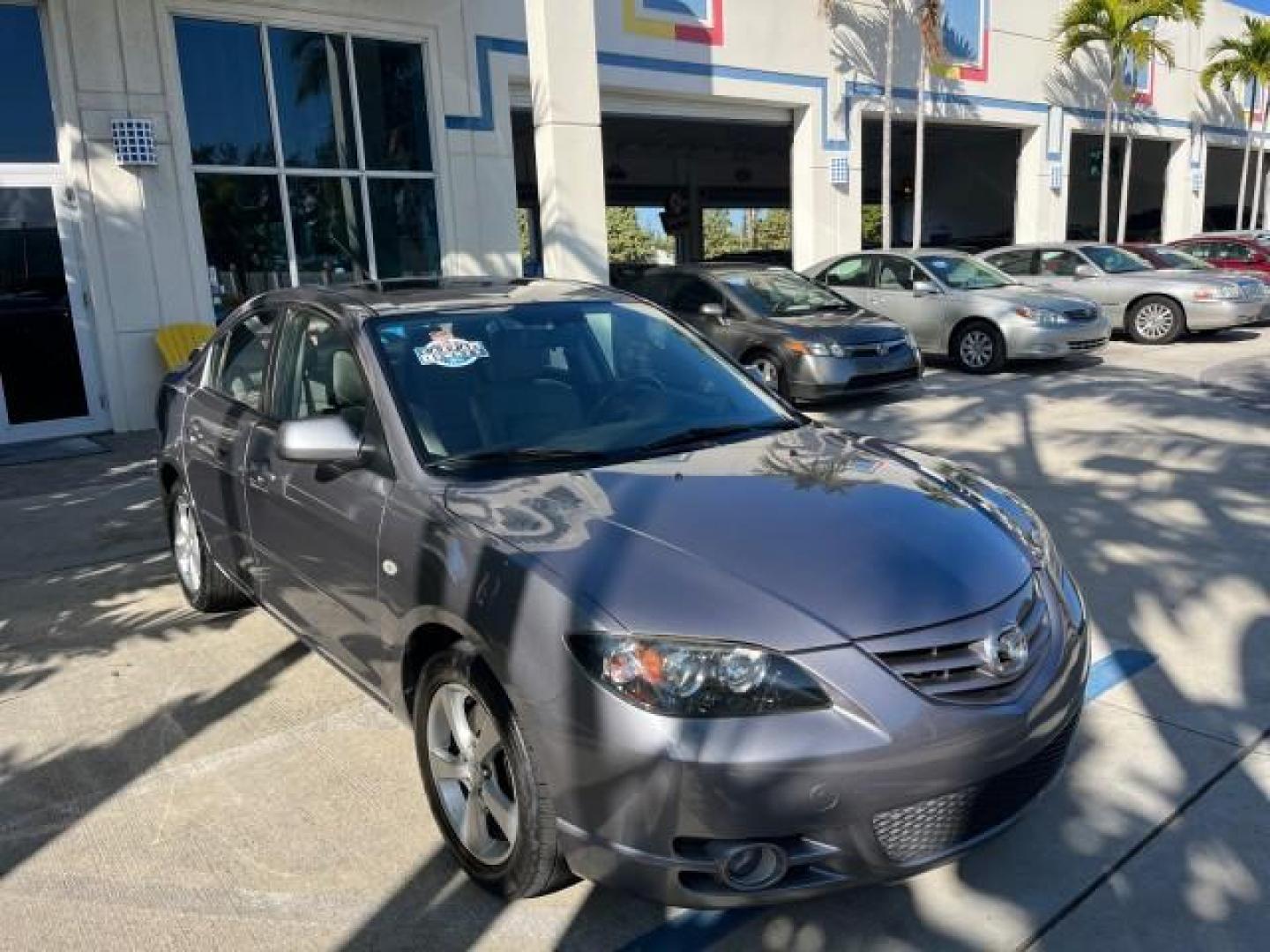 2005 Titanium Gray Metallic /Black Mazda Mazda3 s SUNROOF LOW MILES 43,509 (JM1BK323951) with an 2.3L DOHC MPFI 16-Valve 4-Cyl Engine engine, Automatic transmission, located at 4701 North Dixie Hwy, Pompano Beach, FL, 33064, (954) 422-2889, 26.240938, -80.123474 - OUR WEBPAGE FLORIDACARS1.COM HAS OVER 100 PHOTOS AND FREE CARFAX LINK 2005 MAZDA MAZDA3 S ROAD READY 2.3L I4 VIN: JM1BK323951253248 NO ACCIDENTS 29 MPG SEDAN 4 DR NO RECALLS 1 OWNER 2.3L I4 F DOHC 16V LOW MILES 43,509 GASOLINE POWER SUNROOF LEATHER FRONT WHEEL DRIVE 26 SERVICE RECORDS Alloy Wheels A - Photo#79