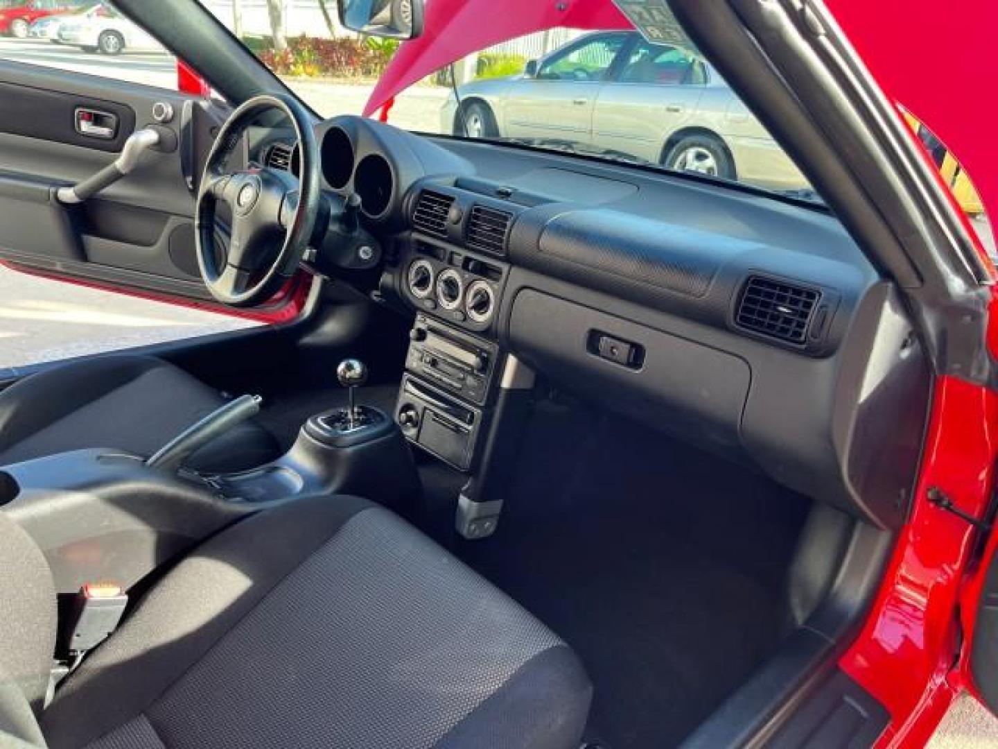 2004 Absolutely Red /Gray Toyota MR2 Spyder 1 FL LOW MILES 6,855 (JTDFR320140) with an 1.8L DOHC MPFI VVT-i 16-Valve 4-Cyl Engine engine, Automatic transmission, located at 4701 North Dixie Hwy, Pompano Beach, FL, 33064, (954) 422-2889, 26.240938, -80.123474 - OUR WEBPAGE FLORIDACARS1.COM HAS OVER 100 PHOTOS AND FREE CARFAX LINK 2004 TOYOTA MR2 SPYDER AUTO ROAD READY 1.8L I4 VIN: JTDFR320140068103 NO ACCIDENTS 33 MPG CONVERTIBLE NO RECALLS 1.8L I4 F DOHC 16V 1 OWNER FLORIDA GASOLINE ONLY 6,855 MILES REAR WHEEL DRIVE CONVERTIBLE TOP Alloy Wheels Approach L - Photo#27