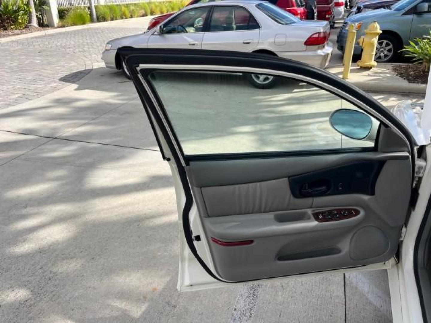 2003 White /Taupe Buick Regal LS LOW MILES 73,246 (2G4WB52K031) with an 3.8L 3800 V6 SFI Engine engine, Automatic transmission, located at 4701 North Dixie Hwy, Pompano Beach, FL, 33064, (954) 422-2889, 26.240938, -80.123474 - OUR WEBPAGE FLORIDACARS1.COM HAS OVER 100 PHOTOS AND FREE CARFAX LINK 2003 BUICK REGAL LS ROAD READY 3.8L V6 VIN: 2G4WB52K031174686 NO ACCIDENTS 29 MPG SEDAN 4 DR LOW MILES 73,246 3.8L V6 F 12V THE BEST POWER LEATHER SEATS GASOLINE 8 SERVICE RECORDS FRONT WHEEL DRIVE POWER MIRRORS DUAL AC Anti-Theft - Photo#9