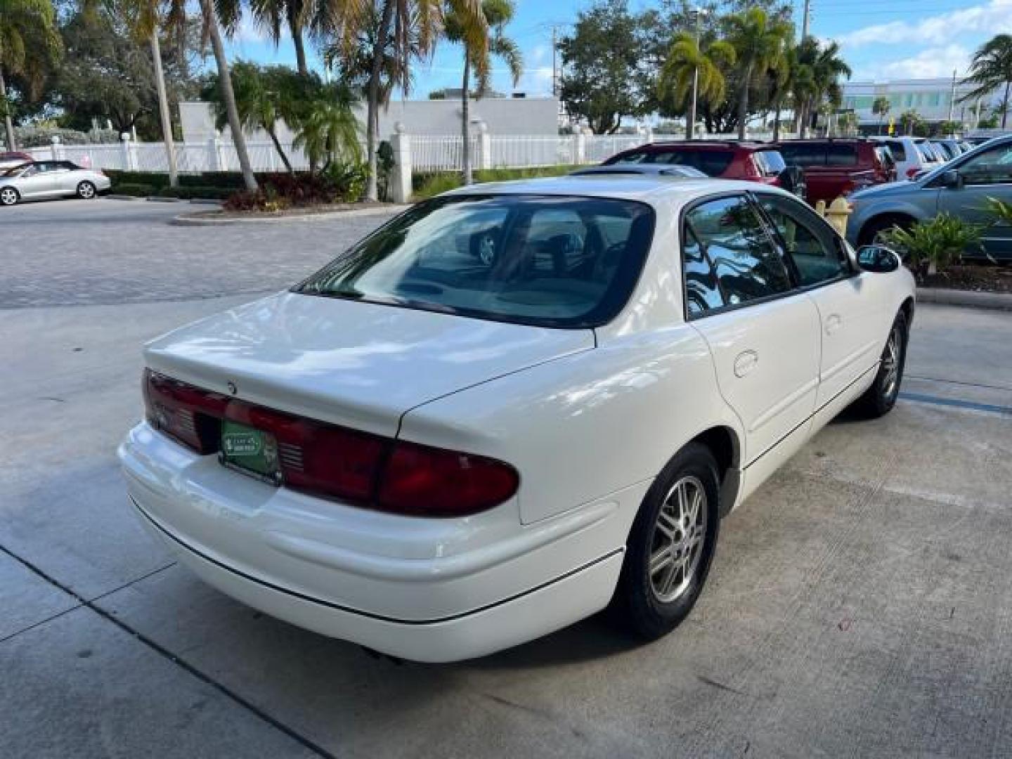 2003 White /Taupe Buick Regal LS LOW MILES 73,246 (2G4WB52K031) with an 3.8L 3800 V6 SFI Engine engine, Automatic transmission, located at 4701 North Dixie Hwy, Pompano Beach, FL, 33064, (954) 422-2889, 26.240938, -80.123474 - OUR WEBPAGE FLORIDACARS1.COM HAS OVER 100 PHOTOS AND FREE CARFAX LINK 2003 BUICK REGAL LS ROAD READY 3.8L V6 VIN: 2G4WB52K031174686 NO ACCIDENTS 29 MPG SEDAN 4 DR LOW MILES 73,246 3.8L V6 F 12V THE BEST POWER LEATHER SEATS GASOLINE 8 SERVICE RECORDS FRONT WHEEL DRIVE POWER MIRRORS DUAL AC Anti-Theft - Photo#99