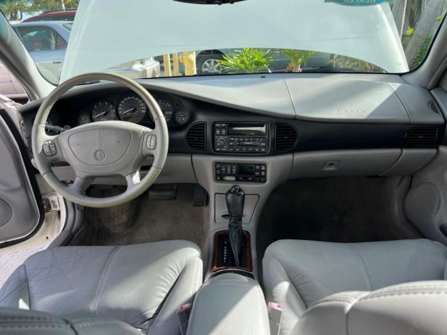 2003 White /Taupe Buick Regal LS LOW MILES 73,246 (2G4WB52K031) with an 3.8L 3800 V6 SFI Engine engine, Automatic transmission, located at 4701 North Dixie Hwy, Pompano Beach, FL, 33064, (954) 422-2889, 26.240938, -80.123474 - OUR WEBPAGE FLORIDACARS1.COM HAS OVER 100 PHOTOS AND FREE CARFAX LINK 2003 BUICK REGAL LS ROAD READY 3.8L V6 VIN: 2G4WB52K031174686 NO ACCIDENTS 29 MPG SEDAN 4 DR LOW MILES 73,246 3.8L V6 F 12V THE BEST POWER LEATHER SEATS GASOLINE 8 SERVICE RECORDS FRONT WHEEL DRIVE POWER MIRRORS DUAL AC Anti-Theft - Photo#33