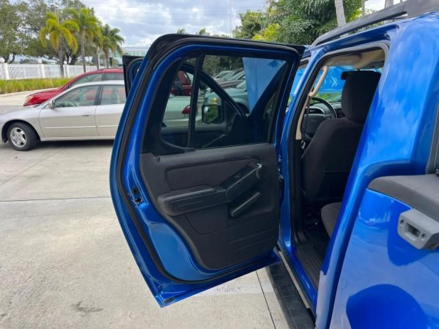 2010 Blue Flame Metallic /Dark Charcoal Ford Explorer Sport Trac 1 OWNER XLT LOW MILES 73,038 (1FMEU3BE9AU) with an 4.0L SOHC 12-Valve V6 Engine engine, Automatic transmission, located at 4701 North Dixie Hwy, Pompano Beach, FL, 33064, (954) 422-2889, 26.240938, -80.123474 - OUR WEBPAGE FLORIDACARS1.COM HAS OVER 100 PHOTOS AND FREE CARFAX LINK 2010 FORD EXPLORER SPORT TRAC XLT ROAD READY 4.0L V6 VIN: 1FMEU3BE9AUF01026 NO RECALLS 1 OWNER SPORT PICKUP LOW MILES 73,038 4.0L V6 F SOHC 12V 17 SERVICE RECORDS GASOLINE POWER SEATS 4.1FT BED REAR WHEEL DRIVE PARK SENSORS 4.1' B - Photo#13