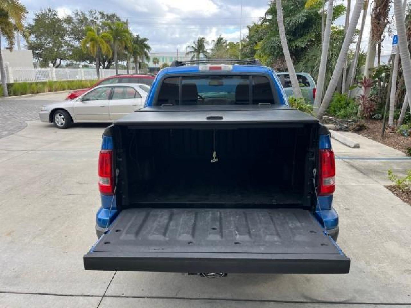 2010 Blue Flame Metallic /Dark Charcoal Ford Explorer Sport Trac 1 OWNER XLT LOW MILES 73,038 (1FMEU3BE9AU) with an 4.0L SOHC 12-Valve V6 Engine engine, Automatic transmission, located at 4701 North Dixie Hwy, Pompano Beach, FL, 33064, (954) 422-2889, 26.240938, -80.123474 - OUR WEBPAGE FLORIDACARS1.COM HAS OVER 100 PHOTOS AND FREE CARFAX LINK 2010 FORD EXPLORER SPORT TRAC XLT ROAD READY 4.0L V6 VIN: 1FMEU3BE9AUF01026 NO RECALLS 1 OWNER SPORT PICKUP LOW MILES 73,038 4.0L V6 F SOHC 12V 17 SERVICE RECORDS GASOLINE POWER SEATS 4.1FT BED REAR WHEEL DRIVE PARK SENSORS 4.1' B - Photo#61
