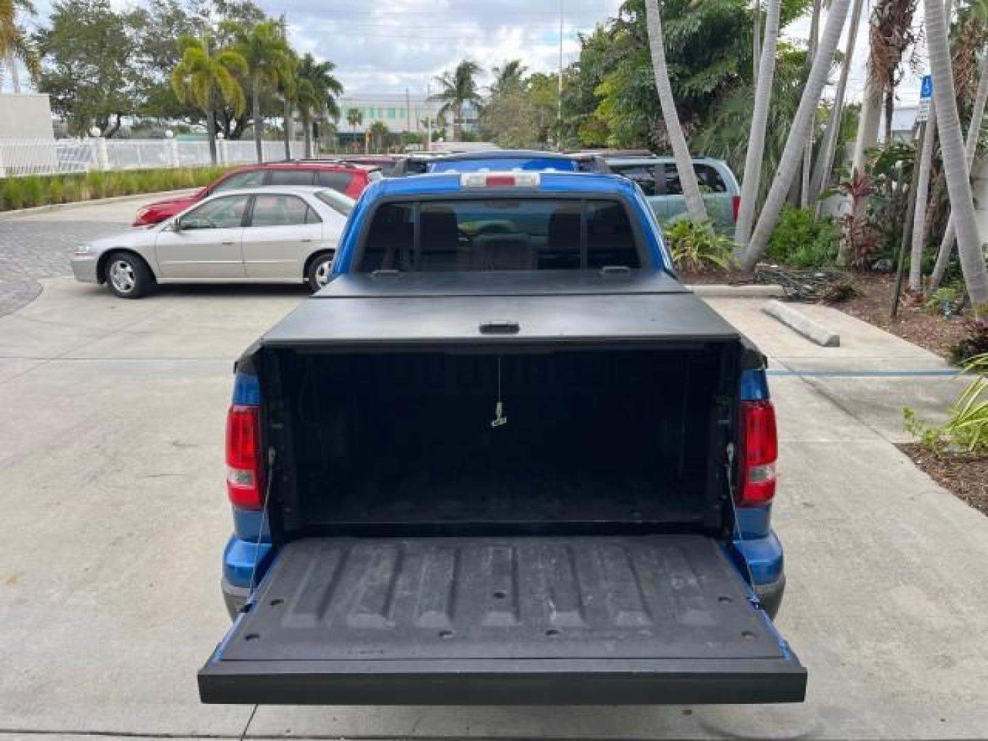 2010 Blue Flame Metallic /Dark Charcoal Ford Explorer Sport Trac 1 OWNER XLT LOW MILES 73,038 (1FMEU3BE9AU) with an 4.0L SOHC 12-Valve V6 Engine engine, Automatic transmission, located at 4701 North Dixie Hwy, Pompano Beach, FL, 33064, (954) 422-2889, 26.240938, -80.123474 - OUR WEBPAGE FLORIDACARS1.COM HAS OVER 100 PHOTOS AND FREE CARFAX LINK 2010 FORD EXPLORER SPORT TRAC XLT ROAD READY 4.0L V6 VIN: 1FMEU3BE9AUF01026 NO RECALLS 1 OWNER SPORT PICKUP LOW MILES 73,038 4.0L V6 F SOHC 12V 17 SERVICE RECORDS GASOLINE POWER SEATS 4.1FT BED REAR WHEEL DRIVE PARK SENSORS 4.1' B - Photo#65