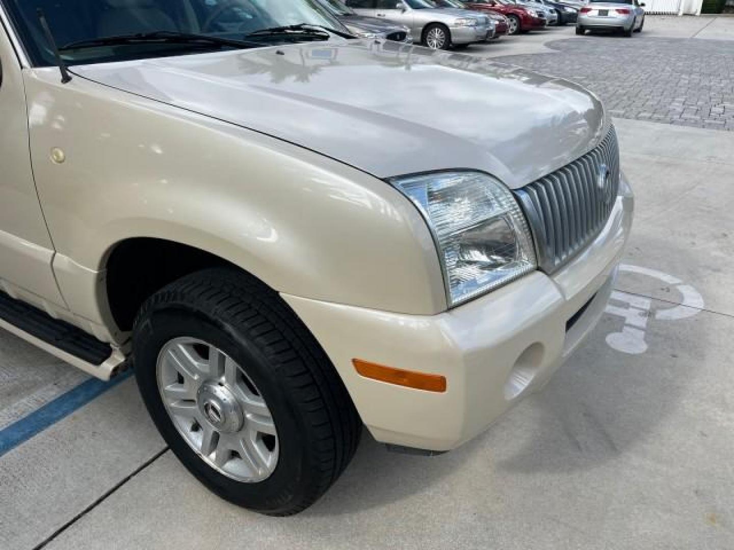 2005 Light French Silk Metallic /Midnight Grey Mercury Mountaineer Premier LOW MILES 49,983 (4M2DU66W55Z) with an 4.6L SOHC SMPI V8 Engine engine, Automatic transmission, located at 4701 North Dixie Hwy, Pompano Beach, FL, 33064, (954) 422-2889, 26.240938, -80.123474 - OUR WEBPAGE FLORIDACARS1.COM HAS OVER 100 PHOTOS AND FREE CARFAX LINK 2005 MERCURY MOUNTAINEER CONVENIENCE ROAD READY 4.6L V8 VIN: 4M2DU66W55ZJ20944 LOW MILES 49,983 4 DOOR WAGON/SPORT UTILITY NO RECALLS DVD SUNROOF 4.6L V8 F POWER LEATHER SEATS GASOLINE POWER SUNROOF/MIRRORS REAR WHEEL DRIVE 3 ROW - Photo#84