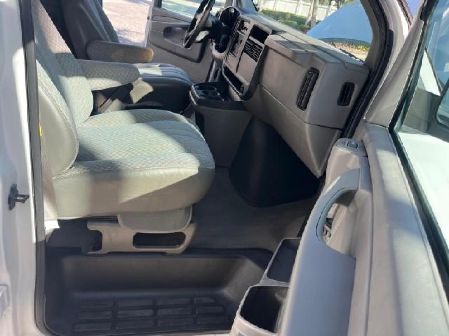 2003 Summit White /Neutral Chevrolet Express Passenger 15 LOW MILES 69,483 (1GAHG39U731) with an 6.0L Vortec 6000 V8 SFI Engine engine, Automatic transmission, located at 4701 North Dixie Hwy, Pompano Beach, FL, 33064, (954) 422-2889, 26.240938, -80.123474 - OUR WEBPAGE FLORIDACARS1.COM HAS OVER 100 PHOTOS AND FREE CARFAX LINK 2003 CHEVROLET EXPRESS 3500 ROAD READY WORK READY VIN: 1GAHG39U731131035 NO RECALLS 6.0L V8 VAN FLORIDA OWNER 6.0L V8 F LOW MILES 69,483 GASOLINE 15 PASSENGER REAR WHEEL DRIVE POWER MIRRORS Front Bucket Seats RWD Rear Air Conditio - Photo#12