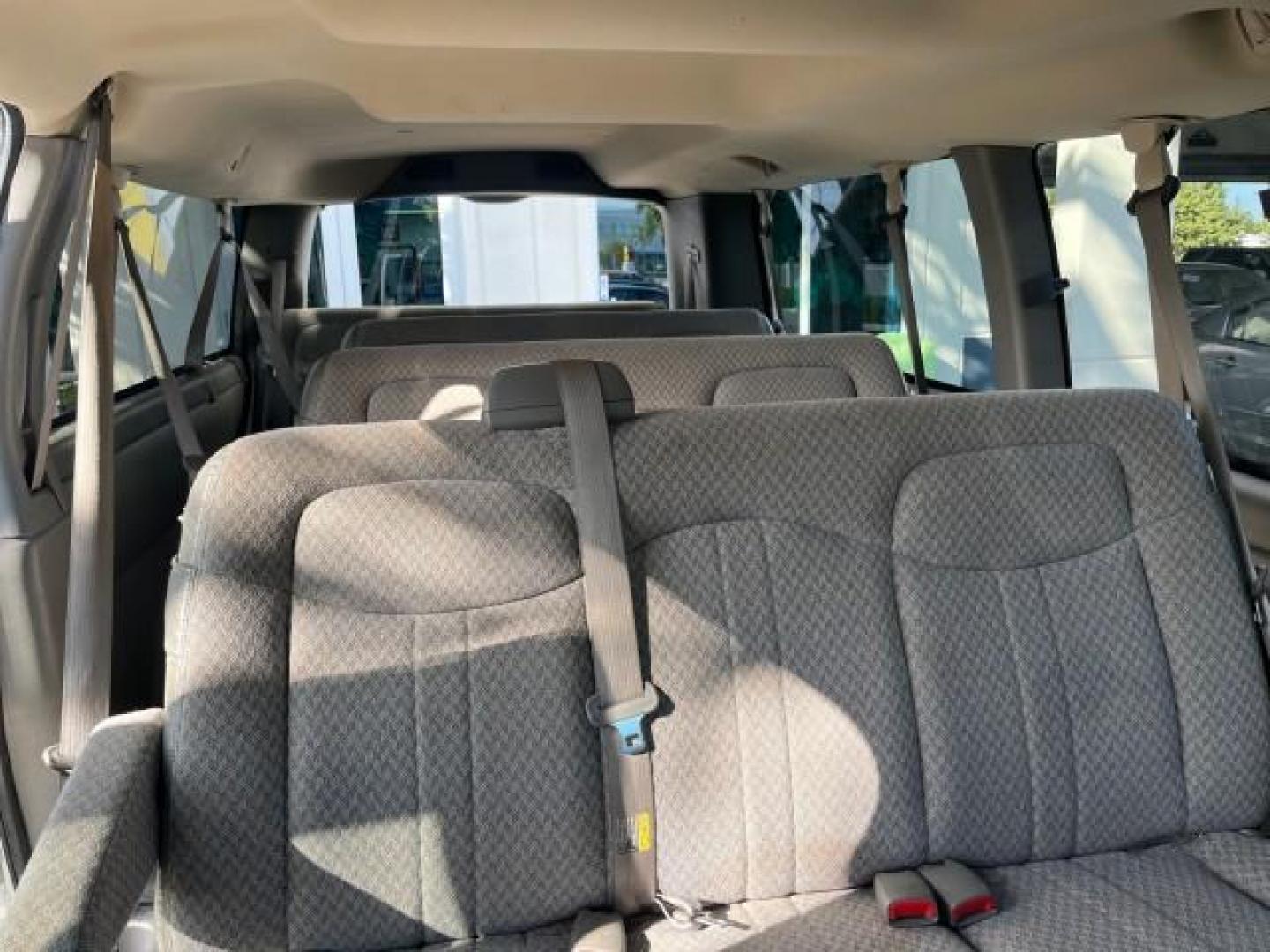 2003 Summit White /Neutral Chevrolet Express Passenger 15 LOW MILES 69,483 (1GAHG39U731) with an 6.0L Vortec 6000 V8 SFI Engine engine, Automatic transmission, located at 4701 North Dixie Hwy, Pompano Beach, FL, 33064, (954) 422-2889, 26.240938, -80.123474 - OUR WEBPAGE FLORIDACARS1.COM HAS OVER 100 PHOTOS AND FREE CARFAX LINK 2003 CHEVROLET EXPRESS 3500 ROAD READY WORK READY VIN: 1GAHG39U731131035 NO RECALLS 6.0L V8 VAN FLORIDA OWNER 6.0L V8 F LOW MILES 69,483 GASOLINE 15 PASSENGER REAR WHEEL DRIVE POWER MIRRORS Front Bucket Seats RWD Rear Air Conditio - Photo#14