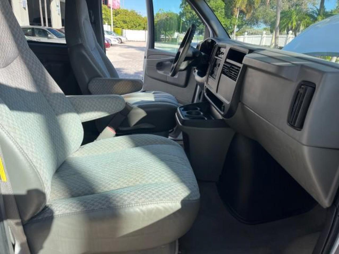 2003 Summit White /Neutral Chevrolet Express Passenger 15 LOW MILES 69,483 (1GAHG39U731) with an 6.0L Vortec 6000 V8 SFI Engine engine, Automatic transmission, located at 4701 North Dixie Hwy, Pompano Beach, FL, 33064, (954) 422-2889, 26.240938, -80.123474 - OUR WEBPAGE FLORIDACARS1.COM HAS OVER 100 PHOTOS AND FREE CARFAX LINK 2003 CHEVROLET EXPRESS 3500 ROAD READY WORK READY VIN: 1GAHG39U731131035 NO RECALLS 6.0L V8 VAN FLORIDA OWNER 6.0L V8 F LOW MILES 69,483 GASOLINE 15 PASSENGER REAR WHEEL DRIVE POWER MIRRORS Front Bucket Seats RWD Rear Air Conditio - Photo#25