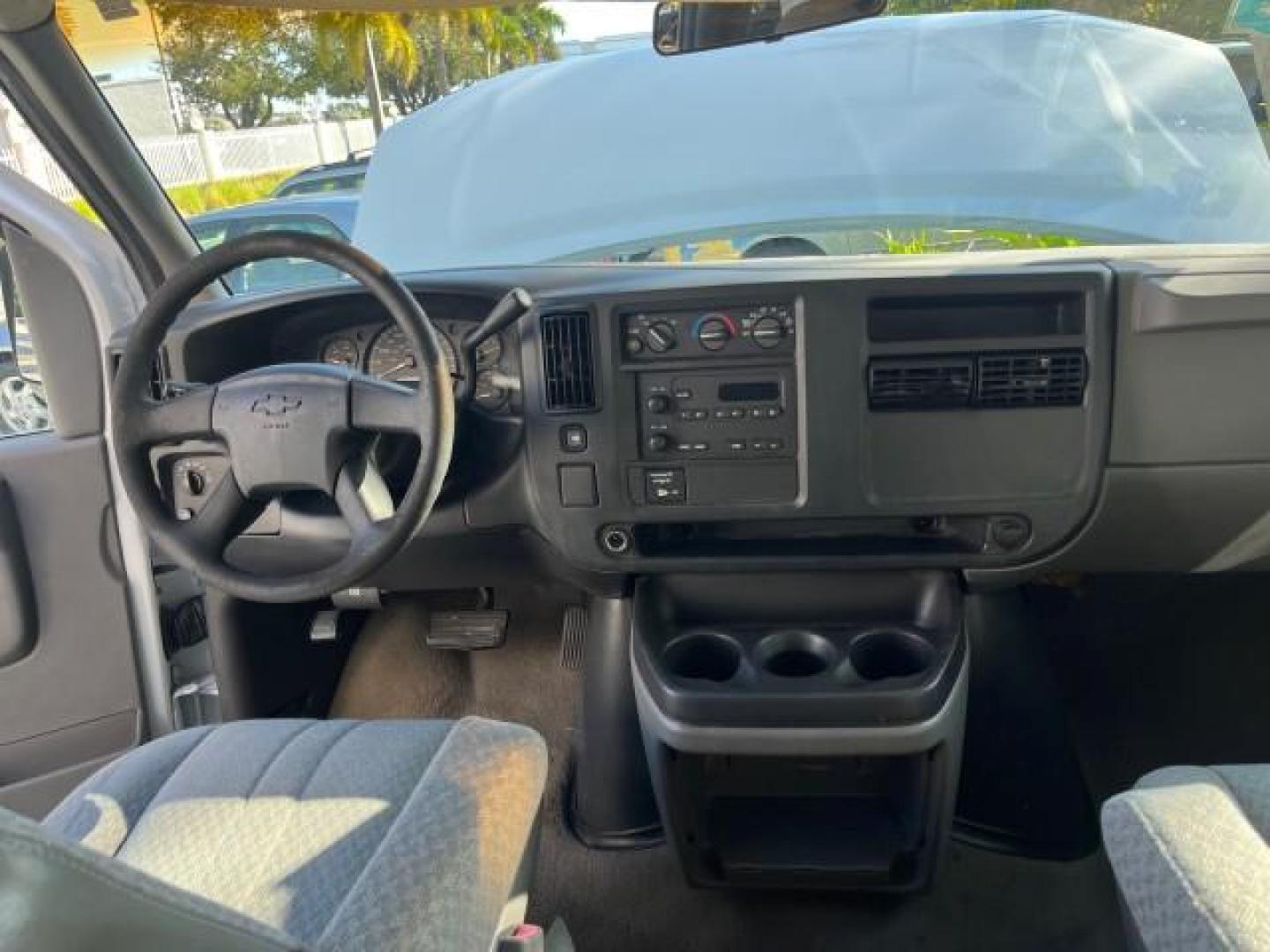 2003 Summit White /Neutral Chevrolet Express Passenger 15 LOW MILES 69,483 (1GAHG39U731) with an 6.0L Vortec 6000 V8 SFI Engine engine, Automatic transmission, located at 4701 North Dixie Hwy, Pompano Beach, FL, 33064, (954) 422-2889, 26.240938, -80.123474 - OUR WEBPAGE FLORIDACARS1.COM HAS OVER 100 PHOTOS AND FREE CARFAX LINK 2003 CHEVROLET EXPRESS 3500 ROAD READY WORK READY VIN: 1GAHG39U731131035 NO RECALLS 6.0L V8 VAN FLORIDA OWNER 6.0L V8 F LOW MILES 69,483 GASOLINE 15 PASSENGER REAR WHEEL DRIVE POWER MIRRORS Front Bucket Seats RWD Rear Air Conditio - Photo#32