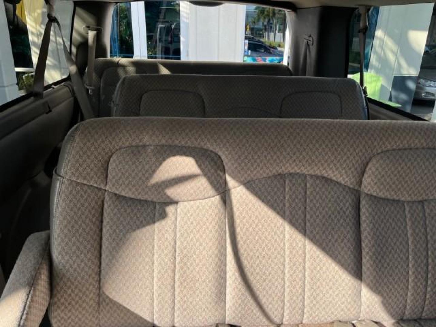 2003 Summit White /Neutral Chevrolet Express Passenger 15 LOW MILES 69,483 (1GAHG39U731) with an 6.0L Vortec 6000 V8 SFI Engine engine, Automatic transmission, located at 4701 North Dixie Hwy, Pompano Beach, FL, 33064, (954) 422-2889, 26.240938, -80.123474 - OUR WEBPAGE FLORIDACARS1.COM HAS OVER 100 PHOTOS AND FREE CARFAX LINK 2003 CHEVROLET EXPRESS 3500 ROAD READY WORK READY VIN: 1GAHG39U731131035 NO RECALLS 6.0L V8 VAN FLORIDA OWNER 6.0L V8 F LOW MILES 69,483 GASOLINE 15 PASSENGER REAR WHEEL DRIVE POWER MIRRORS Front Bucket Seats RWD Rear Air Conditio - Photo#34