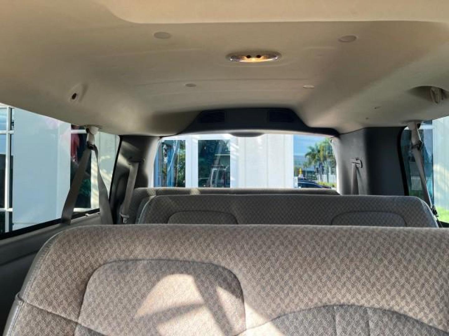 2003 Summit White /Neutral Chevrolet Express Passenger 15 LOW MILES 69,483 (1GAHG39U731) with an 6.0L Vortec 6000 V8 SFI Engine engine, Automatic transmission, located at 4701 North Dixie Hwy, Pompano Beach, FL, 33064, (954) 422-2889, 26.240938, -80.123474 - OUR WEBPAGE FLORIDACARS1.COM HAS OVER 100 PHOTOS AND FREE CARFAX LINK 2003 CHEVROLET EXPRESS 3500 ROAD READY WORK READY VIN: 1GAHG39U731131035 NO RECALLS 6.0L V8 VAN FLORIDA OWNER 6.0L V8 F LOW MILES 69,483 GASOLINE 15 PASSENGER REAR WHEEL DRIVE POWER MIRRORS Front Bucket Seats RWD Rear Air Conditio - Photo#37