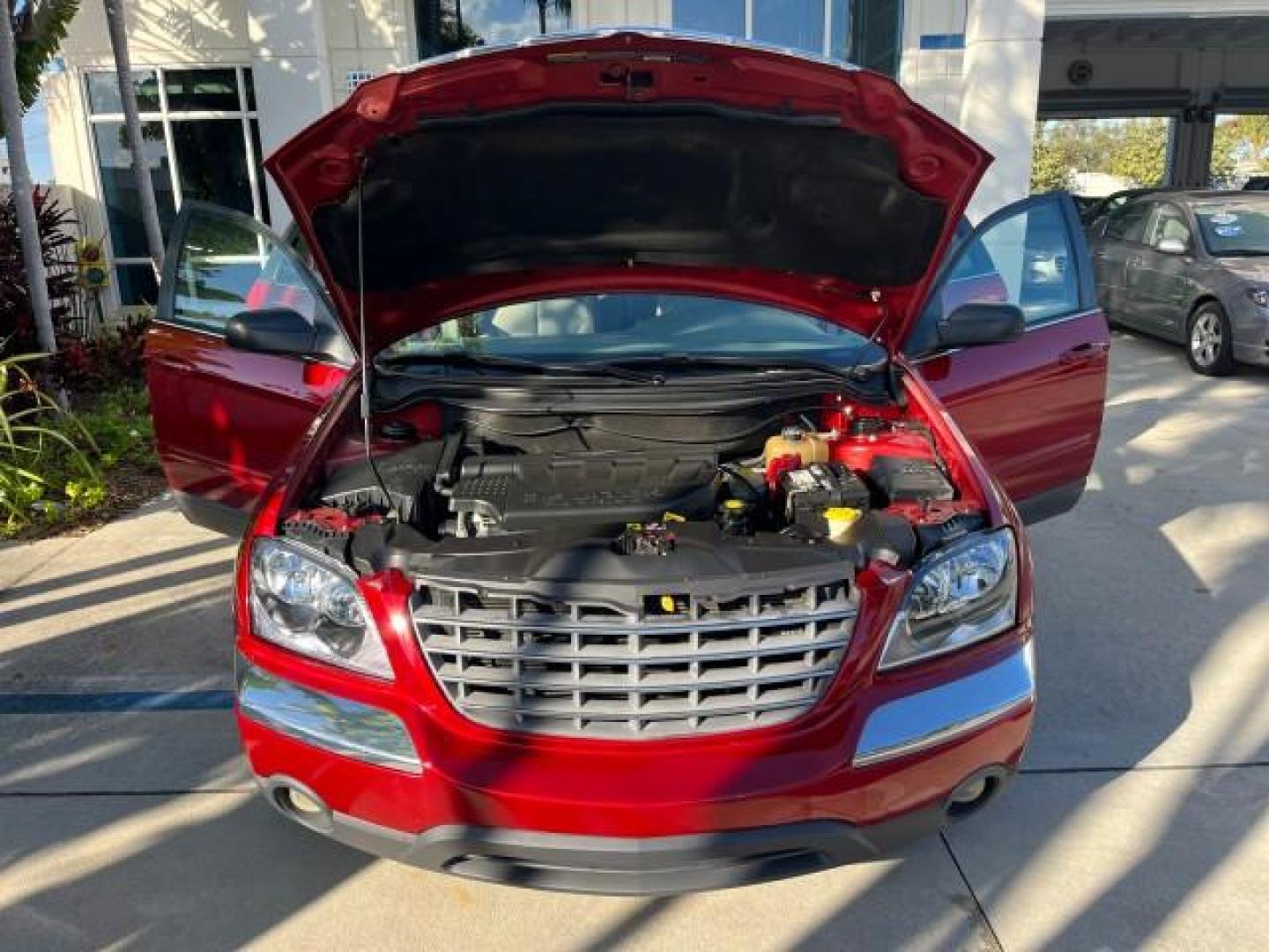 2005 Inferno Red Crystal Pearl /Light Taupe Chrysler Pacifica Touring LOW MILES 67,198 (2C4GM684X5R) with an 3.5L MPI 24-Valve V6 Engine engine, Automatic transmission, located at 4701 North Dixie Hwy, Pompano Beach, FL, 33064, (954) 422-2889, 26.240938, -80.123474 - OUR WEBPAGE FLORIDACARS1.COM HAS OVER 100 PHOTOS AND FREE CARFAX LINK 2005 CHRYSLER PACIFICA TOURING ROAD READY 3.5L V6 VIN: 2C4GM684X5R648035 NO ACCIDENTS 4 DOOR WAGON/SPORT UTILITY NO RECALLS DVD 3.5L V6 F 24V FLORIDA OWNER GASOLINE POWER LIFTGATE LOW MILES 67,198 FRONT WHEEL DRIVE 3 ROW SEATS POW - Photo#16