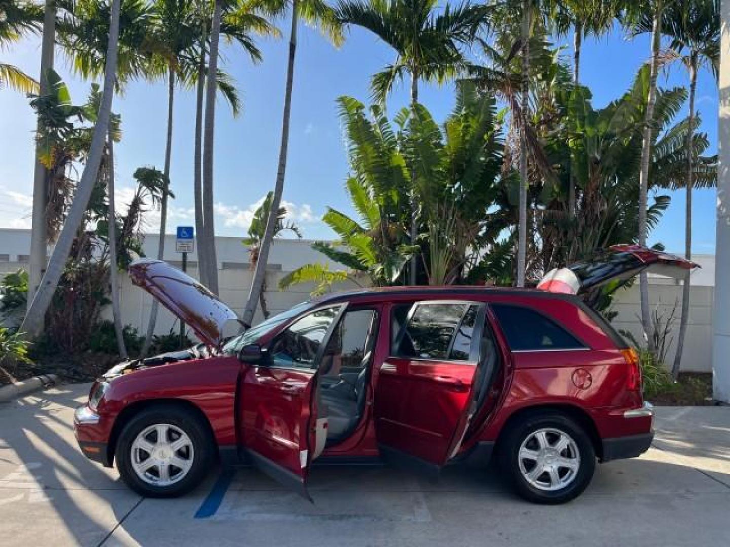 2005 Inferno Red Crystal Pearl /Light Taupe Chrysler Pacifica Touring LOW MILES 67,198 (2C4GM684X5R) with an 3.5L MPI 24-Valve V6 Engine engine, Automatic transmission, located at 4701 North Dixie Hwy, Pompano Beach, FL, 33064, (954) 422-2889, 26.240938, -80.123474 - OUR WEBPAGE FLORIDACARS1.COM HAS OVER 100 PHOTOS AND FREE CARFAX LINK 2005 CHRYSLER PACIFICA TOURING ROAD READY 3.5L V6 VIN: 2C4GM684X5R648035 NO ACCIDENTS 4 DOOR WAGON/SPORT UTILITY NO RECALLS DVD 3.5L V6 F 24V FLORIDA OWNER GASOLINE POWER LIFTGATE LOW MILES 67,198 FRONT WHEEL DRIVE 3 ROW SEATS POW - Photo#8