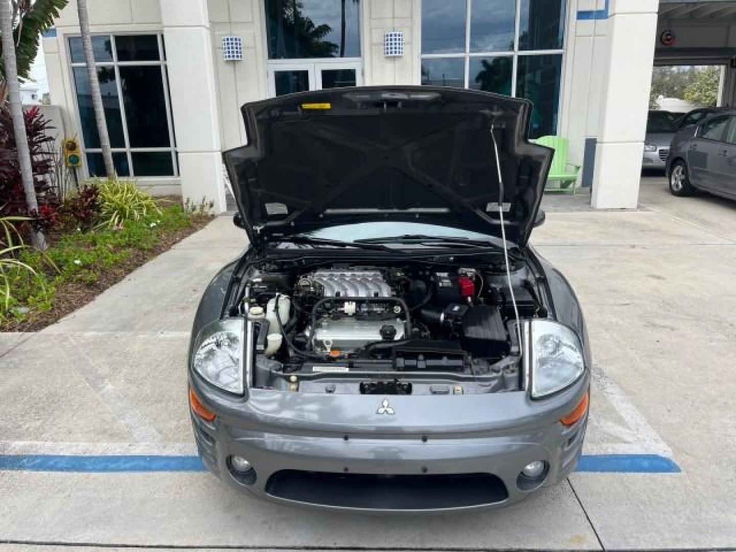 2004 Titanium Pearl /Midnight Mitsubishi Eclipse 1 FL GTS LOW MILES 36,082 (4A3AE75H84E) with an 3.0L SOHC MPFI 24-Valve V6 Variable Induction Engine engine, Automatic transmission, located at 4701 North Dixie Hwy, Pompano Beach, FL, 33064, (954) 422-2889, 26.240938, -80.123474 - OUR WEBPAGE FLORIDACARS1.COM HAS OVER 100 PHOTOS AND FREE CARFAX LINK 2004 MITSUBISHI ECLIPSE SPYDER GTS ROAD READY 3.0L V6 VIN: 4A3AE75H84E116730 NO ACCIDENTS 29 MPG CONVERTIBLE NO RECALLS 1 OWNER 3.0L V6 F DOHC 24V LOW MILES 30,082 GTS GASOLINE POWER CONVERTIBLE TOP POWER LEATHER SEATS FRONT WHEEL - Photo#57