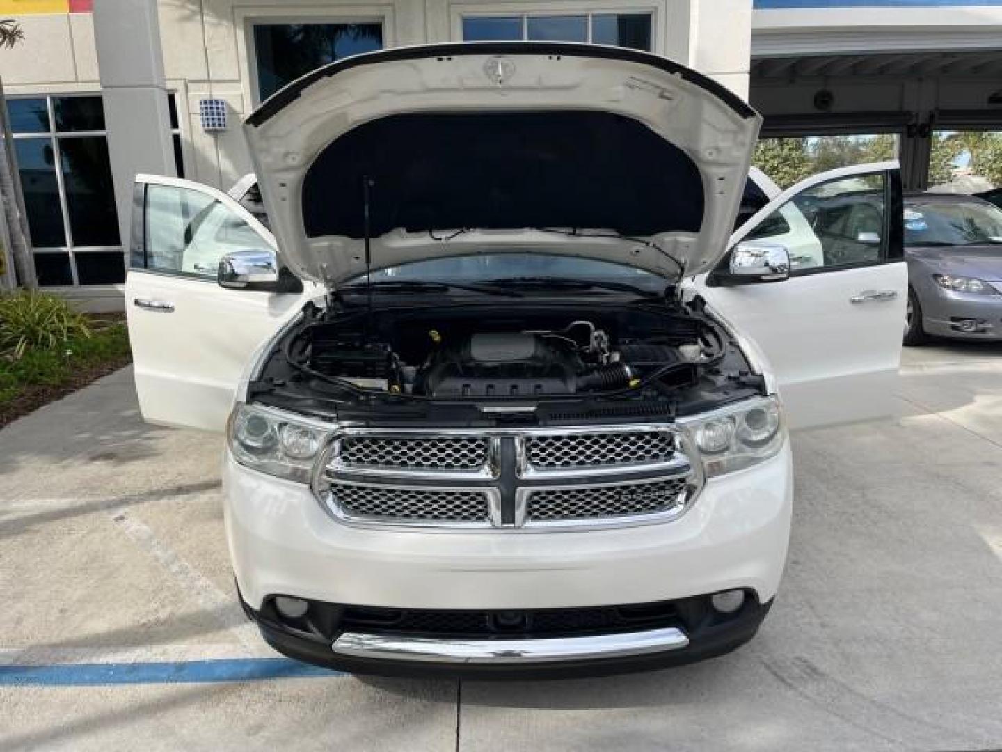 2011 Stone White /Black Dodge Durango Citadel V 8 HEMI LOW MILES 64,436 (1D4SD5GT5BC) with an 5.7L V8 VVT Hemi Multi Displacement Engine engine, Automatic transmission, located at 4701 North Dixie Hwy, Pompano Beach, FL, 33064, (954) 422-2889, 26.240938, -80.123474 - OUR WEBPAGE FLORIDACARS1.COM HAS OVER 100 PHOTOS AND FREE CARFAX LINK 2011 DODGE DURANGO CITADEL ROAD READY 5.7L V8 DVD VIN: 1D4SD5GT5BC694943 NO RECALLS FLORIDA OWNER 4 DOOR WAGON/SPORT UTILITY 3 ROW POWER LEATHER SEATS 5.7L V8 F OHV 16V PUSH START NAVIGATION POWER SUNROOF GASOLINE NEW $ 45,820 BAC - Photo#16