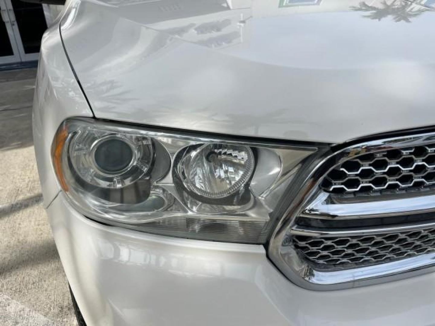 2011 Stone White /Black Dodge Durango Citadel V 8 HEMI LOW MILES 64,436 (1D4SD5GT5BC) with an 5.7L V8 VVT Hemi Multi Displacement Engine engine, Automatic transmission, located at 4701 North Dixie Hwy, Pompano Beach, FL, 33064, (954) 422-2889, 26.240938, -80.123474 - OUR WEBPAGE FLORIDACARS1.COM HAS OVER 100 PHOTOS AND FREE CARFAX LINK 2011 DODGE DURANGO CITADEL ROAD READY 5.7L V8 DVD VIN: 1D4SD5GT5BC694943 NO RECALLS FLORIDA OWNER 4 DOOR WAGON/SPORT UTILITY 3 ROW POWER LEATHER SEATS 5.7L V8 F OHV 16V PUSH START NAVIGATION POWER SUNROOF GASOLINE NEW $ 45,820 BAC - Photo#87