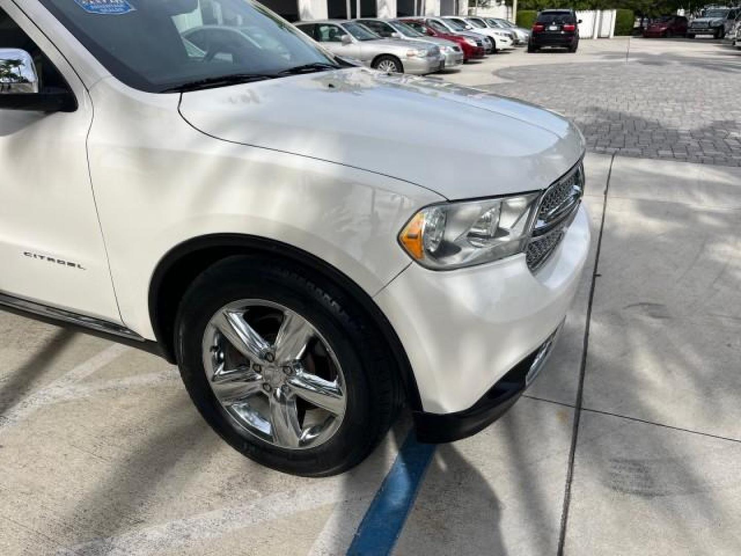 2011 Stone White /Black Dodge Durango Citadel V 8 HEMI LOW MILES 64,436 (1D4SD5GT5BC) with an 5.7L V8 VVT Hemi Multi Displacement Engine engine, Automatic transmission, located at 4701 North Dixie Hwy, Pompano Beach, FL, 33064, (954) 422-2889, 26.240938, -80.123474 - OUR WEBPAGE FLORIDACARS1.COM HAS OVER 100 PHOTOS AND FREE CARFAX LINK 2011 DODGE DURANGO CITADEL ROAD READY 5.7L V8 DVD VIN: 1D4SD5GT5BC694943 NO RECALLS FLORIDA OWNER 4 DOOR WAGON/SPORT UTILITY 3 ROW POWER LEATHER SEATS 5.7L V8 F OHV 16V PUSH START NAVIGATION POWER SUNROOF GASOLINE NEW $ 45,820 BAC - Photo#96