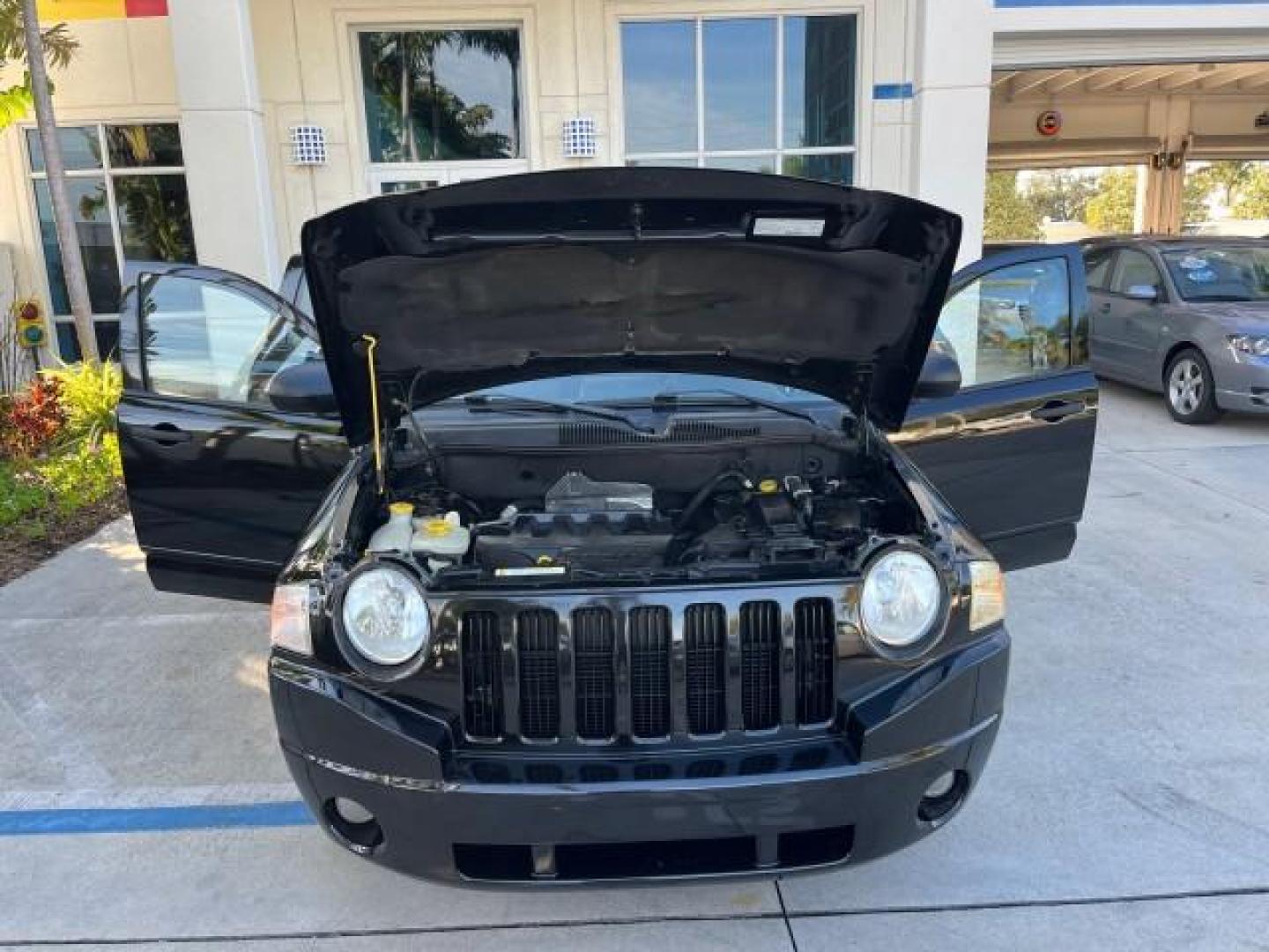 2008 Brilliant Blk Crystal Pearl /Dark Slate Gray Jeep Compass Sport LOW MILES 55,563 (1J8FT47W28D) with an 2.4L DOHC 16v I4 Dual VVT Engine engine, Automatic transmission, located at 4701 North Dixie Hwy, Pompano Beach, FL, 33064, (954) 422-2889, 26.240938, -80.123474 - OUR WEBPAGE FLORIDACARS1.COM HAS OVER 100 PHOTOS AND FREE CARFAX LINK 2008 JEEP COMPASS SPORT ROAD READY 2.4L I4 VIN: 1J8FT47W28D549845 NO ACCIDENTS 29 MPG 4 DOOR WAGON/SPORT UTILITY NO RECALLS 2.4L I4 F DOHC 16V FLORIDA OWNER GASOLINE LOW MILES 55,563 FRONT WHEEL DRIVE 9 SERVICE RECORDS Anti-Theft - Photo#16