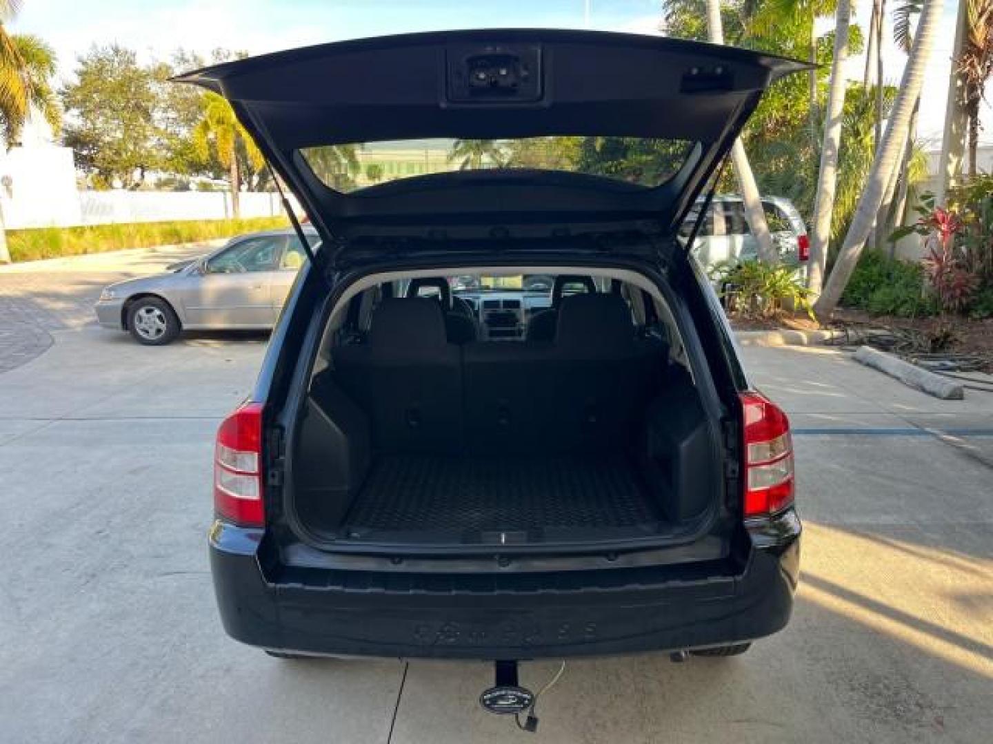 2008 Brilliant Blk Crystal Pearl /Dark Slate Gray Jeep Compass Sport LOW MILES 55,563 (1J8FT47W28D) with an 2.4L DOHC 16v I4 Dual VVT Engine engine, Automatic transmission, located at 4701 North Dixie Hwy, Pompano Beach, FL, 33064, (954) 422-2889, 26.240938, -80.123474 - OUR WEBPAGE FLORIDACARS1.COM HAS OVER 100 PHOTOS AND FREE CARFAX LINK 2008 JEEP COMPASS SPORT ROAD READY 2.4L I4 VIN: 1J8FT47W28D549845 NO ACCIDENTS 29 MPG 4 DOOR WAGON/SPORT UTILITY NO RECALLS 2.4L I4 F DOHC 16V FLORIDA OWNER GASOLINE LOW MILES 55,563 FRONT WHEEL DRIVE 9 SERVICE RECORDS Anti-Theft - Photo#60