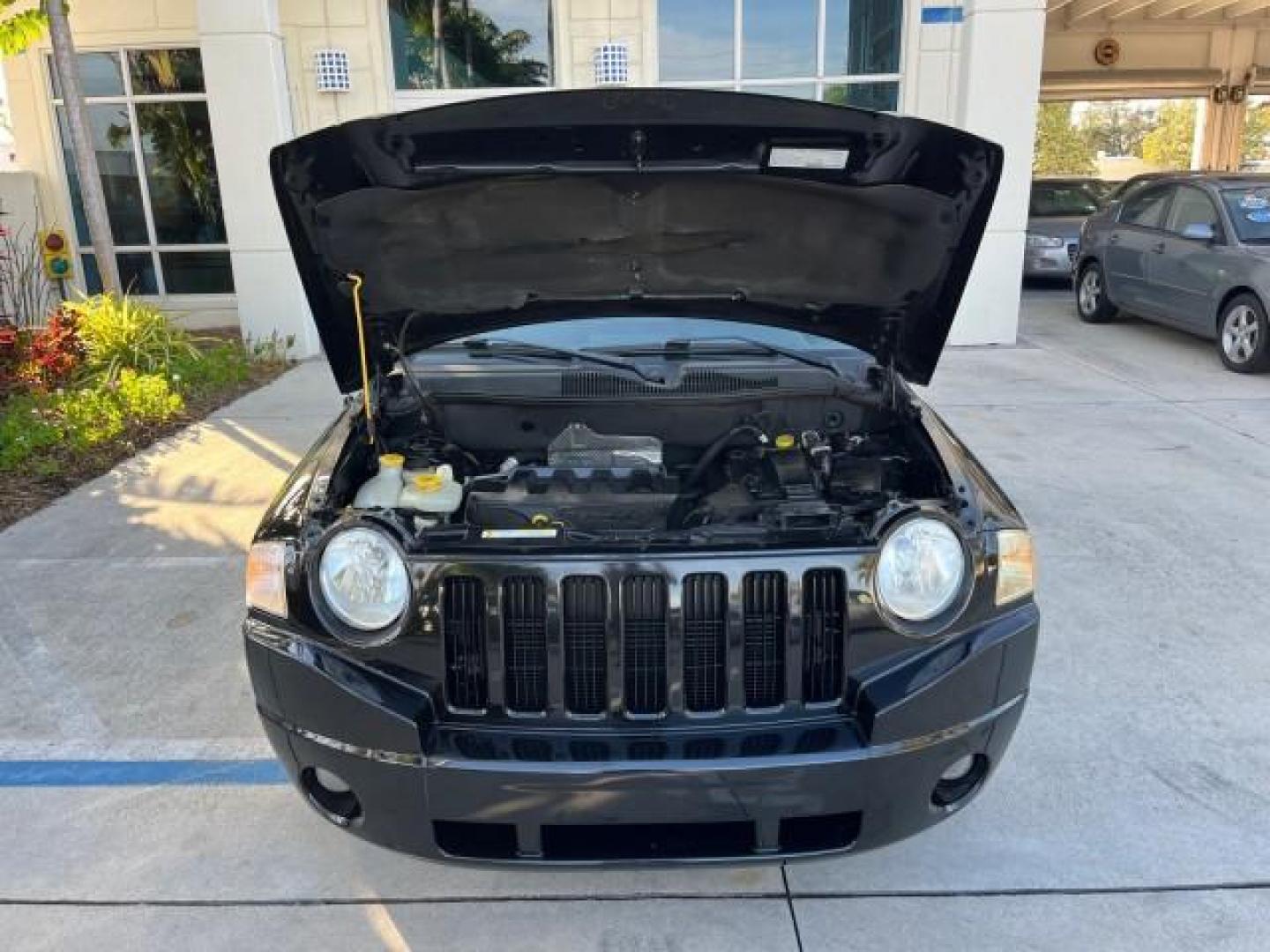 2008 Brilliant Blk Crystal Pearl /Dark Slate Gray Jeep Compass Sport LOW MILES 55,563 (1J8FT47W28D) with an 2.4L DOHC 16v I4 Dual VVT Engine engine, Automatic transmission, located at 4701 North Dixie Hwy, Pompano Beach, FL, 33064, (954) 422-2889, 26.240938, -80.123474 - OUR WEBPAGE FLORIDACARS1.COM HAS OVER 100 PHOTOS AND FREE CARFAX LINK 2008 JEEP COMPASS SPORT ROAD READY 2.4L I4 VIN: 1J8FT47W28D549845 NO ACCIDENTS 29 MPG 4 DOOR WAGON/SPORT UTILITY NO RECALLS 2.4L I4 F DOHC 16V FLORIDA OWNER GASOLINE LOW MILES 55,563 FRONT WHEEL DRIVE 9 SERVICE RECORDS Anti-Theft - Photo#66