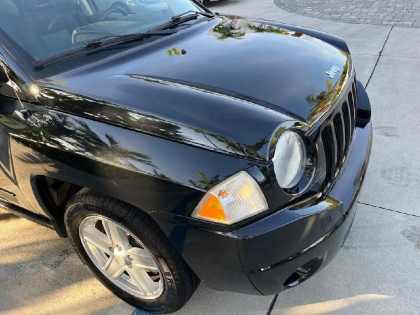 2008 Brilliant Blk Crystal Pearl /Dark Slate Gray Jeep Compass Sport LOW MILES 55,563 (1J8FT47W28D) with an 2.4L DOHC 16v I4 Dual VVT Engine engine, Automatic transmission, located at 4701 North Dixie Hwy, Pompano Beach, FL, 33064, (954) 422-2889, 26.240938, -80.123474 - OUR WEBPAGE FLORIDACARS1.COM HAS OVER 100 PHOTOS AND FREE CARFAX LINK 2008 JEEP COMPASS SPORT ROAD READY 2.4L I4 VIN: 1J8FT47W28D549845 NO ACCIDENTS 29 MPG 4 DOOR WAGON/SPORT UTILITY NO RECALLS 2.4L I4 F DOHC 16V FLORIDA OWNER GASOLINE LOW MILES 55,563 FRONT WHEEL DRIVE 9 SERVICE RECORDS Anti-Theft - Photo#82