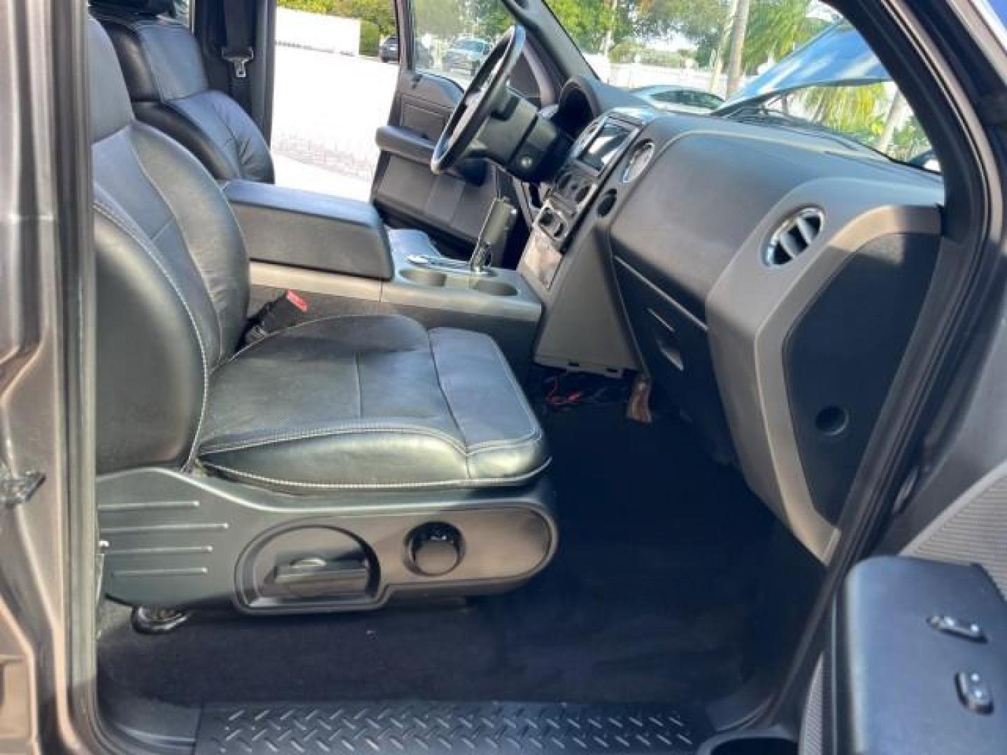 2005 Dark Shadow Grey Metallic /Black Ford F-150 1 FL FX4 4X4 LOW MILES 80,488 (1FTPW14535K) with an 5.4L 3v EFI V8 Engine engine, Automatic transmission, located at 4701 North Dixie Hwy, Pompano Beach, FL, 33064, (954) 422-2889, 26.240938, -80.123474 - OUR WEBPAGE FLORIDACARS1.COM HAS OVER 100 PHOTOS AND FREE CARFAX LINK 2005 FORD F-150 XLT ROAD READY 5.4L V8 VIN: 1FTPW14535KE86307 FX4 NO ACCIDENTS 4X4 CREW PICKUP BLUETOOTH NAVI NO RECALLS 1 OWNER FL 5.4L V8 F SOHC POWER SUNROOF 5,6FT BED LENGTH GASOLINE POWER LEATHER SEATS LOW MILES 80,488 REAR W - Photo#12