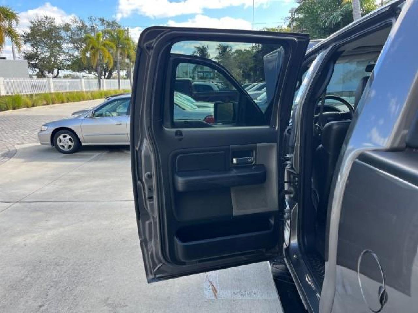 2005 Dark Shadow Grey Metallic /Black Ford F-150 1 FL FX4 4X4 LOW MILES 80,488 (1FTPW14535K) with an 5.4L 3v EFI V8 Engine engine, Automatic transmission, located at 4701 North Dixie Hwy, Pompano Beach, FL, 33064, (954) 422-2889, 26.240938, -80.123474 - OUR WEBPAGE FLORIDACARS1.COM HAS OVER 100 PHOTOS AND FREE CARFAX LINK 2005 FORD F-150 XLT ROAD READY 5.4L V8 VIN: 1FTPW14535KE86307 FX4 NO ACCIDENTS 4X4 CREW PICKUP BLUETOOTH NAVI NO RECALLS 1 OWNER FL 5.4L V8 F SOHC POWER SUNROOF 5,6FT BED LENGTH GASOLINE POWER LEATHER SEATS LOW MILES 80,488 REAR W - Photo#13