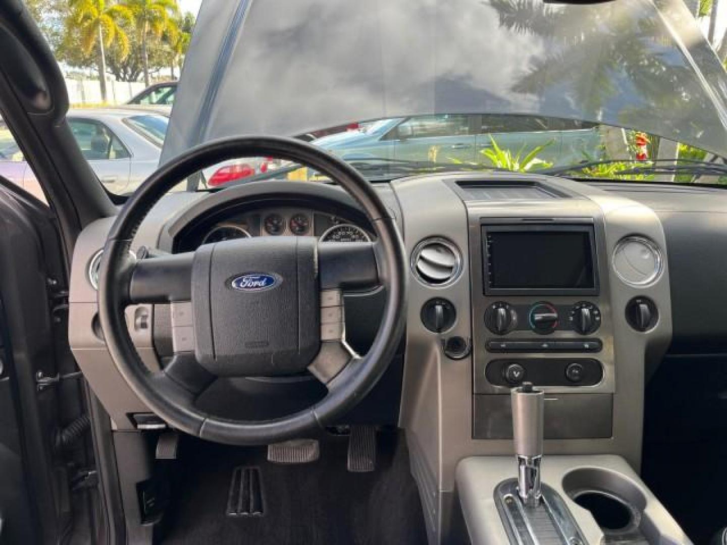 2005 Dark Shadow Grey Metallic /Black Ford F-150 1 FL FX4 4X4 LOW MILES 80,488 (1FTPW14535K) with an 5.4L 3v EFI V8 Engine engine, Automatic transmission, located at 4701 North Dixie Hwy, Pompano Beach, FL, 33064, (954) 422-2889, 26.240938, -80.123474 - OUR WEBPAGE FLORIDACARS1.COM HAS OVER 100 PHOTOS AND FREE CARFAX LINK 2005 FORD F-150 XLT ROAD READY 5.4L V8 VIN: 1FTPW14535KE86307 FX4 NO ACCIDENTS 4X4 CREW PICKUP BLUETOOTH NAVI NO RECALLS 1 OWNER FL 5.4L V8 F SOHC POWER SUNROOF 5,6FT BED LENGTH GASOLINE POWER LEATHER SEATS LOW MILES 80,488 REAR W - Photo#37