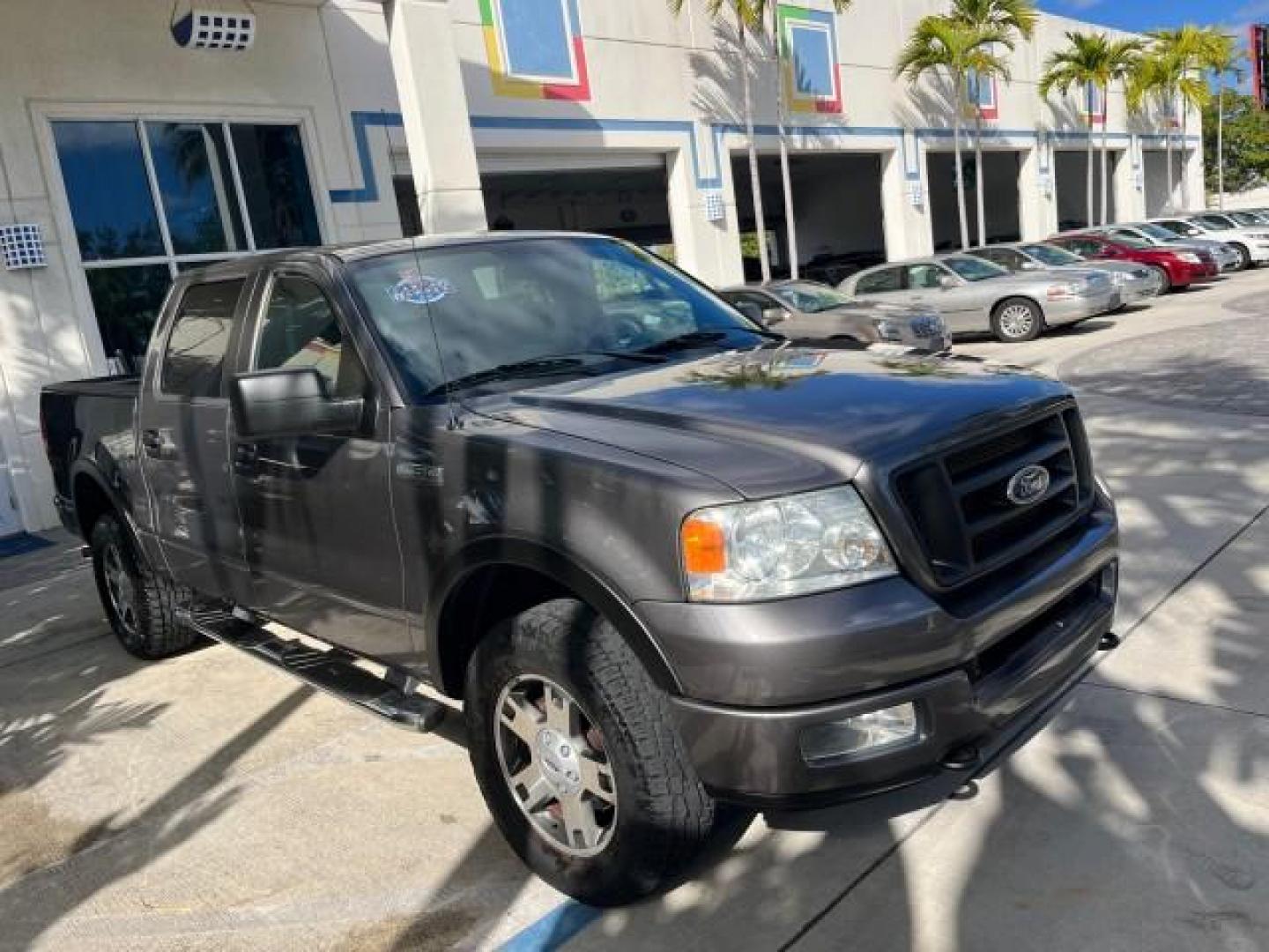 2005 Dark Shadow Grey Metallic /Black Ford F-150 1 FL FX4 4X4 LOW MILES 80,488 (1FTPW14535K) with an 5.4L 3v EFI V8 Engine engine, Automatic transmission, located at 4701 North Dixie Hwy, Pompano Beach, FL, 33064, (954) 422-2889, 26.240938, -80.123474 - OUR WEBPAGE FLORIDACARS1.COM HAS OVER 100 PHOTOS AND FREE CARFAX LINK 2005 FORD F-150 XLT ROAD READY 5.4L V8 VIN: 1FTPW14535KE86307 FX4 NO ACCIDENTS 4X4 CREW PICKUP BLUETOOTH NAVI NO RECALLS 1 OWNER FL 5.4L V8 F SOHC POWER SUNROOF 5,6FT BED LENGTH GASOLINE POWER LEATHER SEATS LOW MILES 80,488 REAR W - Photo#65